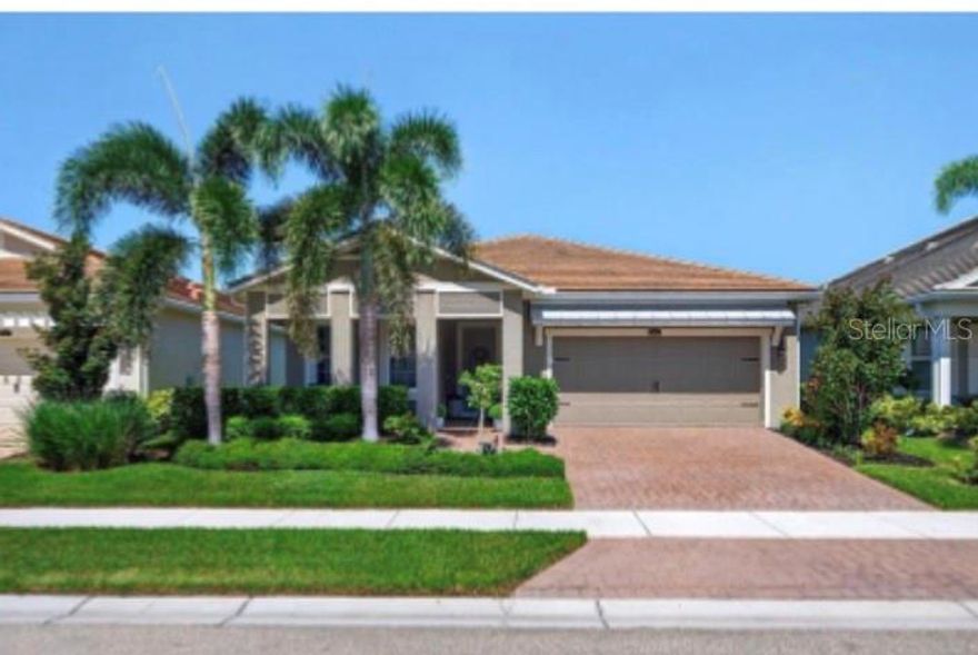 Now is the time to buy! Enjoy an incredible new price! Welcome to one of the most intimate, maintenance-free communities close to the world- famous Siesta Key beaches and only 15 minutes to downtown Sarasota. This gated community offers convenient access to shopping, the interstate, and a variety of great restaurants. The home is bright and airy with abundant natural light, and the primary suite serves as a peaceful retreat with a private en-suite and personal spa-like comforts. Located at **5858 Long Shore Loop**, this residence was built in 2021 and features **over $100,000 in upgrades**. The **gourmet kitchen** is enhanced with quartz countertops, 42-inch cabinets, and a custom pantry. Tray ceilings, crown molding, 8-foot doors, and wood plank tile floors contribute to the open design. A **flex room with closet** adds versatility as a third bedroom or office. Outdoor living includes a **kitchen with sink, refrigerator, and natural gas grill**, while additional features include a **2-person sauna/salt room**, impact-rated hurricane windows (2025), pocket sliding glass doors, SPF window treatments, and a **garage with epoxy floor and storage systems**. **Furniture package available separately**, offering buyers the option for a turnkey experience with furnished bedrooms, living room, dining set, and patio. Sunrise Preserve offers resort-style amenities including a clubhouse with fully catered kitchen, fitness center, yoga studio, pool & spa, tennis, pickleball, and bocce courts. Plus a full time Community association director. NO CDD's. Located near the legacy trail and 1 mile to the interstate.
