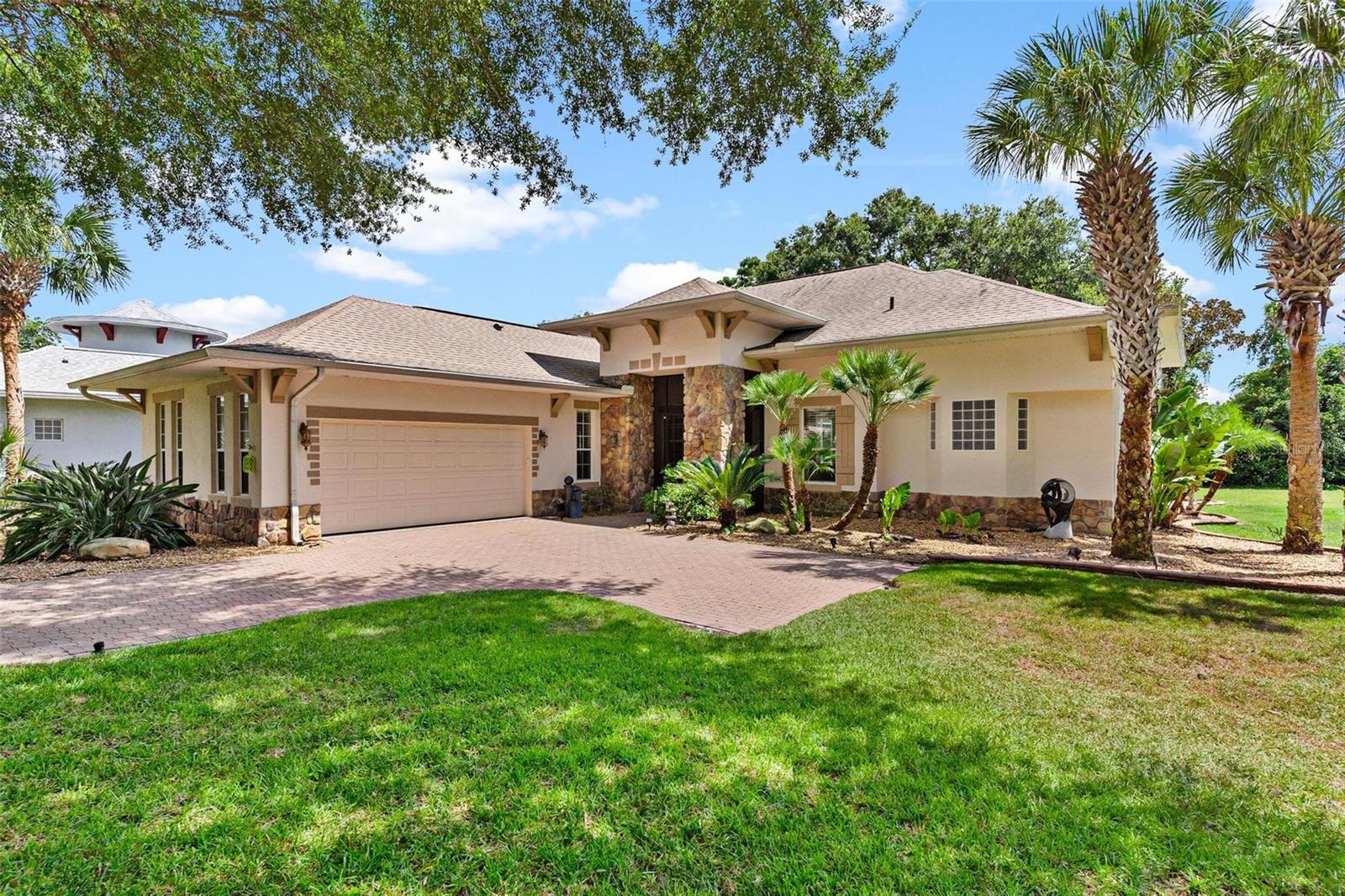PRICE IS RIGHT...$399,500! Spectacular home located on a quiet street in this "sought after" guard gated 24/7, golfing, all age community with a private backyard to enjoy family BBQs! Brick paver driveway leads you to the front porch for outdoor enjoyment. Seller has improved and updated home throughout ownership to include new paint, flooring and complete kitchen redesign, adding gorgeous granite countertops and replacement of appliances! The popular Great Room Concept features the kitchen with an oversized breakfast area/ family room combo great for today's busy lifestyle. Also, enjoy the benefit of a separate room for your formal dining!! Working from home is a pleasure from your own private den/office!! The split plan design includes two large En Suites plus an additional half guest bath with stylish pedestal sink! Primary Suite #1 features 2 walk in closets, bath with separate raised dual vanities, & water closet, shower plus soaking tub for bubble bath relaxation!! Suite #2 with large walk-in closet and bath with oversized shower! Convenient inside Laundry Room with sink & custom cabinets convey "top of the line" Washer & Dryer. Huge rear screen porch lanai with additional birdcage is great for entertaining! Less to worry about when the roof is less than 5 years old and HVAC with heat pump replaced within the last few...Don't miss this opportunity to make this your next home!! Country Club and Golf membership is optional and available for a separate fee! NO REGRETS...CALL TODAY!!