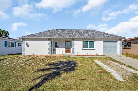 Photo of 8425 Redfield Drive, Port Richey, FL 34668 (MLS # TB8452253)