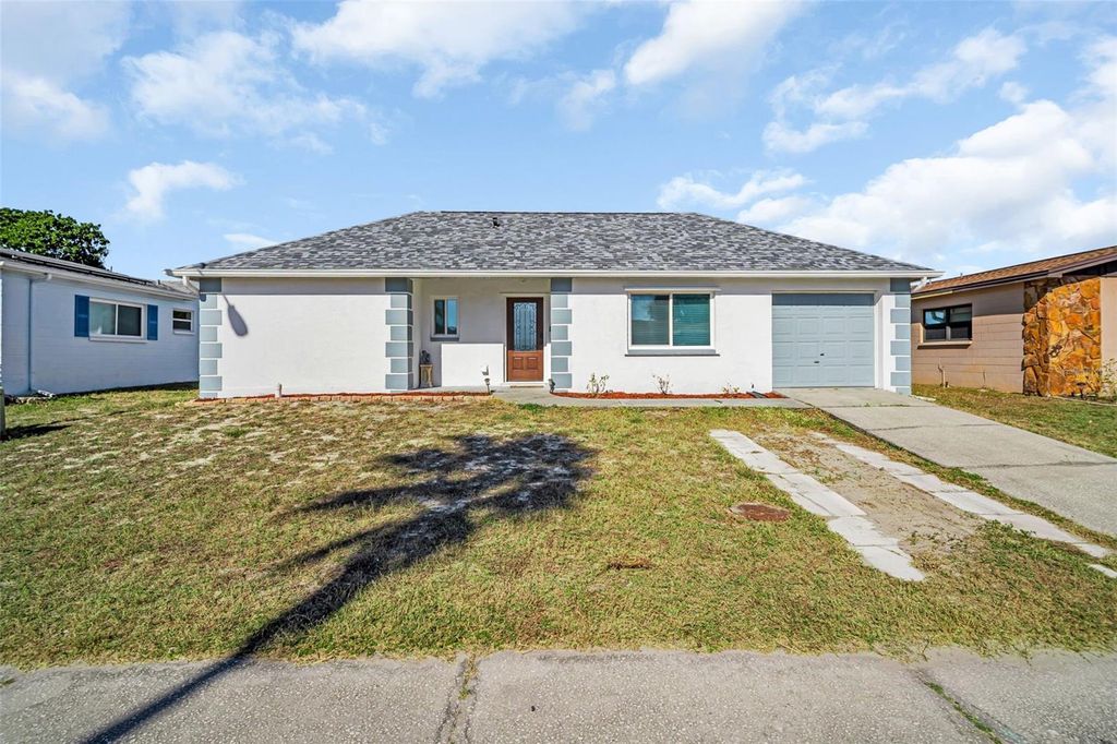 Photo of 8425 Redfield Drive, Port Richey, FL 34668 (MLS # TB8452253)