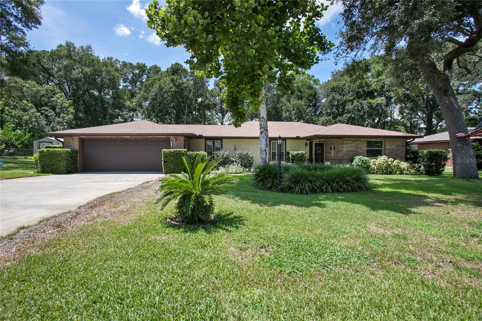 WELCOME to this charming and beautifully maintained pool home located on an oversized 0.48-acre fenced lot in the highly sought-after Country Club Estates of DeLand. This spacious residence offers a thoughtful and inviting layout featuring formal living and dining rooms, a large family room with vaulted ceilings, skylights, and a stunning stone fireplace, as well as a bright kitchen with a breakfast bar and cozy dinette. The highlight of the home is the Florida room, which provides a perfect view of the screened-in pool and lanai—ideal for year-round enjoyment. Recent updates include a new roof (2023), updated electrical system (2019), new windows, and a dedicated irrigation well. With its blend of comfort, functionality, and outdoor living, all in a quiet and well-established neighborhood, this home is truly a rare find. Don’t miss your chance to own this exceptional property—schedule your private tour today!