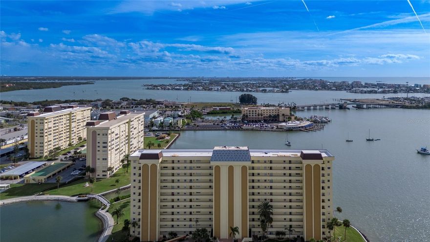 EXPERIENCE COASTAL LIVING AT ITS FINEST IN THE BEAUTIFUL 2 BEDROOM, 2 BATH CONDO IN THE SOUGHT-AFTER SEA TOWERS OVER 55+ COMMUNITY. PERFECTLY POSITIONED ON THE 10TH FLOOR, THIS HOME OFFERS SWEEPING VIEWS OF THE RESORT-STYLE POOL AND BREATHTAKING SUNSETS AND UNOBSTRUCTED INTRACOASTAL WATERWAYS-- ALL VISIBLE FROM EVERY ROOM.  INSIDE, THE OPEN FLOOR PLAN IS A SPACIOUS LIVING AREA FLOODED WITH NATURAL LIGHT AND FLOWS SEEMLESSLY INTO A WELL APPOINTED OPEN CONCEPT KITCHEN FEATURING AMPLE CABINETRY, STAINLESS STEEL APPLIANCES AND THE PERFECT LAYOUT FOR ENTERTAINING OR CASUAL MEALS. BOTH BEDROOMS ARE GENEROUSLY SIZED, PROVIDING PEACEFUL RETREATS WITH SERENE VIEWS. THE PRIMARY SUITE INCLUDES A LARGE WALK IN CLOSET WITH CUSTOM STORAGE SYSTEMS  AND A PRIVATE ENSUITE BATH.  BOTH BATH ROOMS HAVE BEEN FRESHLY PAINTED, NEW LIGHT FIXTURES AND GUEST BATH SHOWER RE-TILED ALONG WITH NEW MOLDING AND DOOR CASINGS. THE CONDO INCLUDES A WASHER BUT LAUNDRY IS ALSO DOWN THE HALL. THE  LIVINGROOM  AND HALLWAY FEATURES BAMBOO FLOORING, NEW CHANDLIER, AND A CUSTOM GLASS DOOR LEADING TO THE SUNROOM. MAJOR SYSTEMS HAVE BEEN UPGRADED:  AC 2019, EFFICIENT HOT WATER HEATER 2021, ANDERSON WINDOWS WITH PULL-DOWN SCREENS, HURRICANE SHUTTERS, COVERED CARPORT, PRIVAE HALLWAY STORAGE UNIT.  RESIDENTS ENJOY A HOST OF AMENITIES INCLUDING TWO SPARKLING POOLS, FITNESS CENTER, LIBRARY AND INVITING COMMUNITY SPACES WITH DEDICATED PARKING FOR RESIDENTS AND GUESTS.  OUTDOOR AMENITIES ARE SURE TO PLEASE AS WELL. YOU ARE WELCOME TO HOST A PARTY IN THE BBQ AND PICNIC AREA OR CHALLENGE EACH OTHER AT THE SHUFFLEBOARD OR TENNIS COURTS, LAWN BOWLING, PUTTING GREEN, AEROBICS, YOGA, WATERER AEROBICS, PLAY DARTS, BRIDGE, BINGO, PINOCHIE, MAH JONGG, DAY TRIPS, WALKING AND BIKING TRAILS, FISHING PIER, BOAT DOCK AND COVERED BOAT SLIP RENTALS. PLS CALL FOR YOUR PRIVATE TOUR.