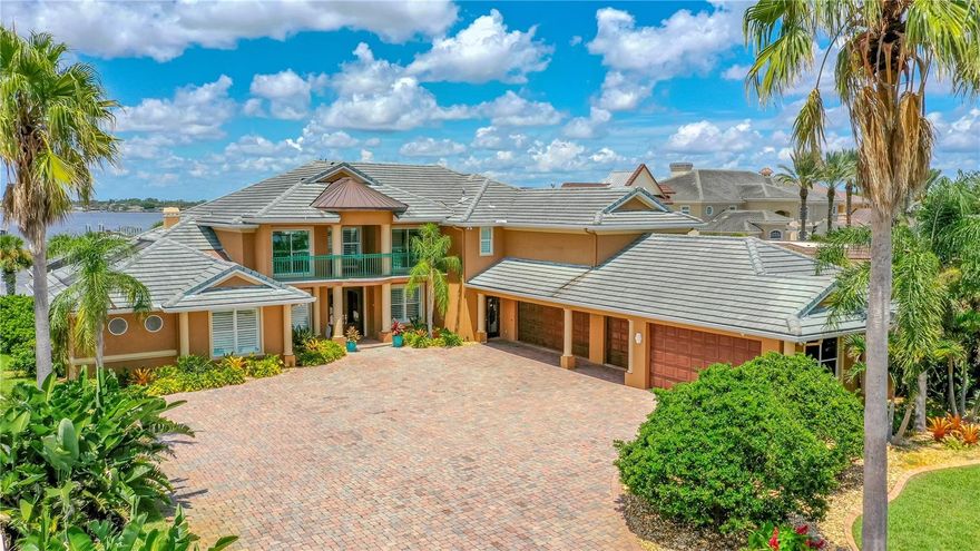 Exceptional gated Beachside Riverfront Estate on 1.27 acres! 9,000 sq foot of custom-built luxury with 5 car garage built in 2002 one block from the beach with 154 feet on the water, a 460’ dock with 2 boat lifts plus additional slip. 5 bedrooms, 7 baths with 6,377 sq feet under air with master bedrooms up and down and water views from almost every room. Formal living room with 20’ ceilings. Formal dining room with built-in buffet and butler's pantry with wet bar. Family room with built-ins, electric fireplace, and amazing 2-story atrium living room on the river. Large custom kitchen with two islands, gas cooktop, desk area, and walk-in pantry. 1st floor home office plus workspace upstairs. 1st-floor master suite with sitting room, fireplace, and access to patio. Amazing master bath with his/hers sinks, 2 walk-in closets, and a whirlpool tub plus a large walk-in shower. 1st-floor in-law suite with private bath. Upstairs you will find the 2nd master with a private bath plus 2 ample sized bedrooms with jack-n-jill bath, a game room with pool/ping pong table, a soundproof home theater room with new projector and huge screen with kitchen area, plus a large additional family room with amazing river views. 2nd-floor balconies in front and rear to enjoy sunrise to amazing sunsets each night. Great outdoor entertaining area with huge covered paver patio with new sun shades plus summer kitchen and heated pool with hot tub and pool bath plus outdoor shower. The fenced in back yard is very private with a small beach area on the riverfront. The fishing off the dock is amazing. Catch snapper, shark, trout, flounder and many types of fish. The front yard is expansive with a security gate and cameras plus room for another 5+ car garage or tennis courts. You are going to love this truly amazing waterfront home. You will not be disappointed!