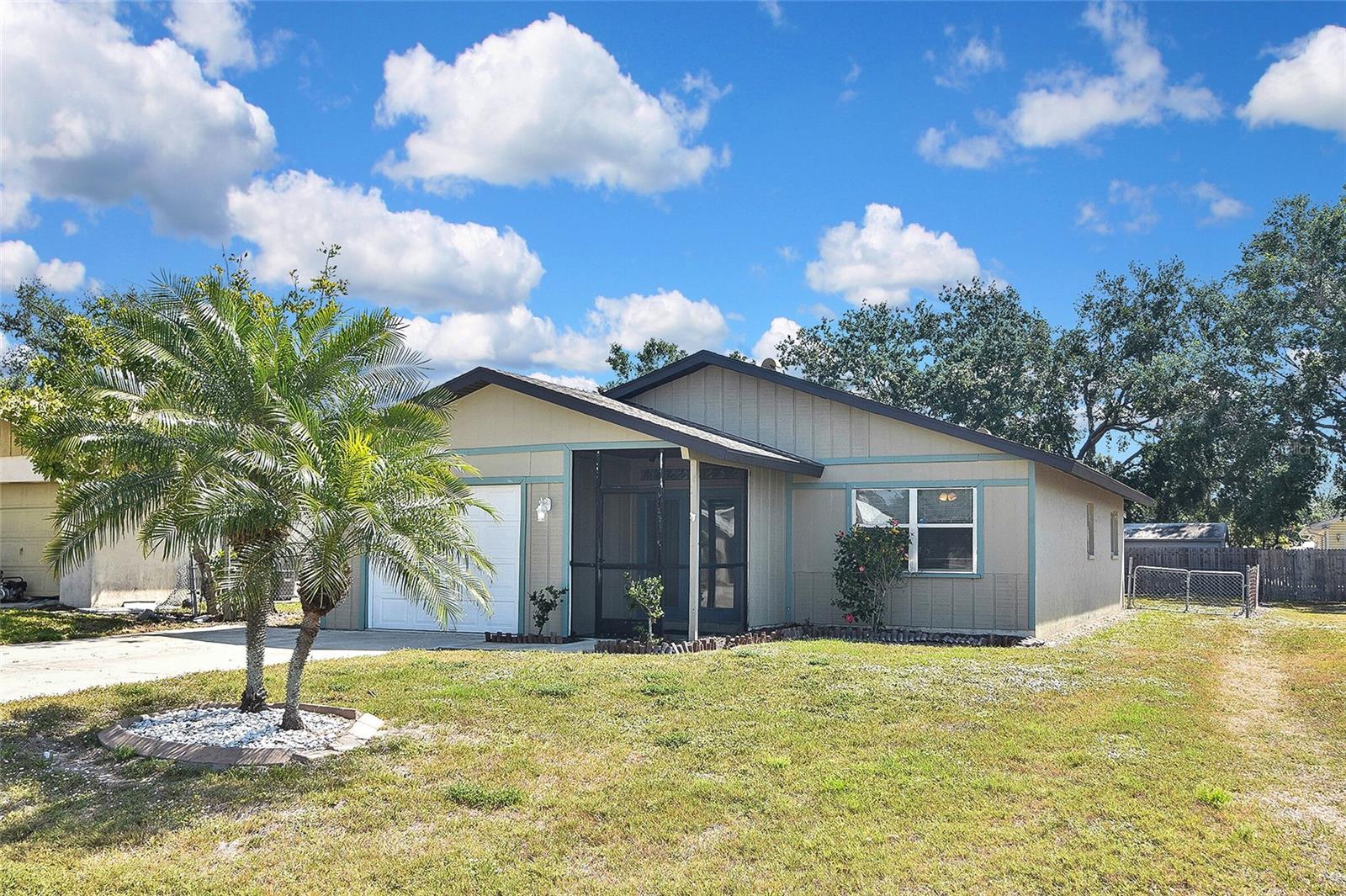 Don't miss this opportunity to own this 2 bed 2 bath home on a quiet dead end street with no HOA fees or restrictions. This home has ceramic tile and laminated flooring, interior / exterior paint 2 years new. Very spacious living room and dining area with attractive crown molding. Fenced large backyard and screened in lanai. Master bathroom has a large walk in shower. One car garage and extra wide driveway for plenty of parking space. Septic tank and drain field replaced in 2019, new A/C in 2021, water heater in 2022. Home water filtration system in place. This home is move in ready! Centrally located, close to shops, restaurants, beaches, bus line and Pinecraft.