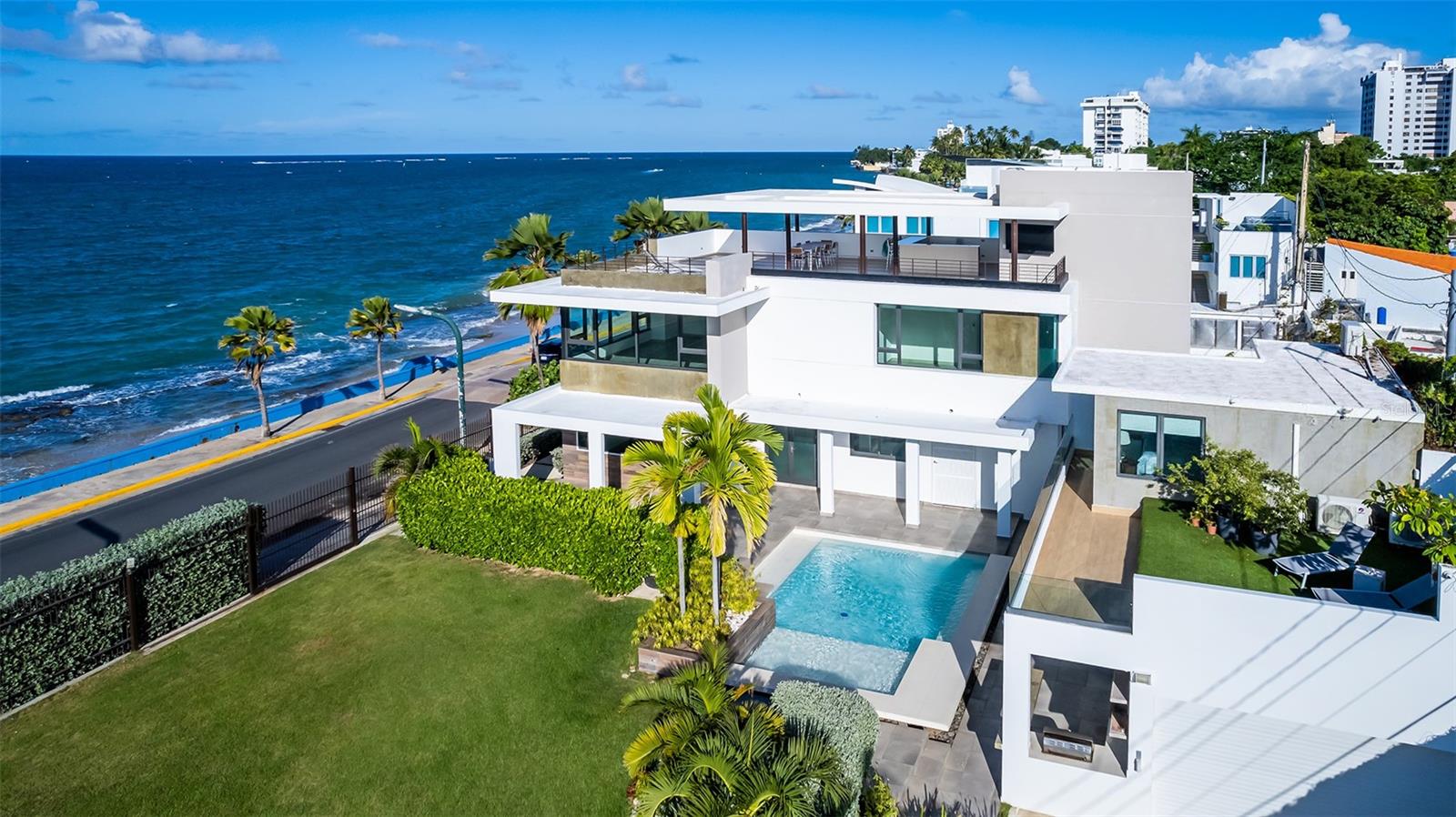 Originally built in 2010 and renovated in 2019 (including some extensions) under the expertise of the well-known architect Cesar Bobonis to reflect the surrounding natural beauty. The property consists of a main house and a guest villa. In three levels the main house features a gross area of 7,046 square feet. Clean and sleek interiors feature glass windows and walls facing stunning turquoise water views. This modern and elegant residence includes six bedrooms, six bathrooms, living-dining room, kitchen, family room and a roof terrace, one of the highlights of the house where you can enjoy spectacular sunrises and sunsets and entertain the most demanding guests. The guest villa features two small apartments each with a private full bathroom. The upper-level unit has a sundeck where you can enjoy stunning ocean views.