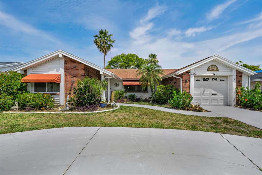 Welcome to waterfront living in Holiday! This beautifully maintained 2-bedroom, 2-bath home offers 1,334 square feet of comfortable living space with no HOA and peaceful pond views. Inside, you’ll find tile flooring throughout the main living areas, brand-new carpet, and an updated kitchen featuring a new refrigerator, range, and dishwasher. Major updates provide peace of mind, including new doors and windows installed in 2011, a new roof in 2020, and A/C replaced in 2020. Enjoy a spacious layout, abundant natural light, and relaxing water views right from your backyard. Holiday offers the perfect blend of Gulf Coast living, outdoor recreation, and nearby waterfront attractions. Just minutes away, you can enjoy beautiful beaches and sunsets at Fred Howard Park and Howard Park Beach, explore scenic walking trails and wildlife at Key Vista Nature Park, or spend the day boating, fishing, and kayaking near Anclote River Park. Nearby Tarpon Springs is famous for its historic Sponge Docks, authentic Greek restaurants, shopping, and waterfront entertainment, while ferry access to Anclote Key Island offers pristine beaches and island adventures.