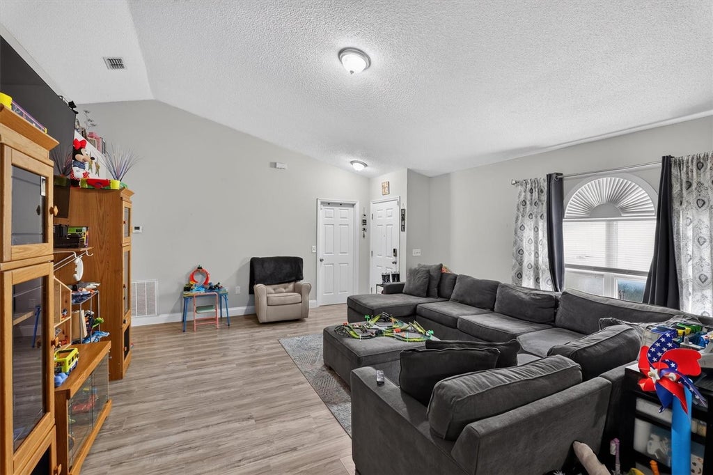 Photo of 13071 Odyssey Lake Way, Orlando, FL 32826 (MLS # O6444924)