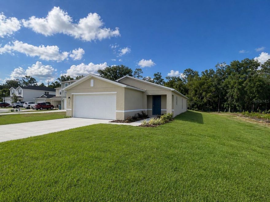 Brand New 3-Bedroom, 2-Bath Home with Private Forest View - Best Lot in the Community!

Welcome to this beautiful new construction home, located on one of the most desirable lots in the community. This 3-bedroom, 2-bath home features a covered lanai overlooking a peaceful forest, along with a private front yard with views of an orange field, creating a quiet and relaxing setting.

Step into the bright and inviting great room, which flows seamlessly into the dining area and modern kitchen. The kitchen is equipped with granite countertops, quality cabinetry, and stainless steel appliances, including a range, microwave hood, dishwasher, refrigerator, and a spacious walk-in pantry.

The private primary suite includes a walk-in closet and an ensuite bathroom with dual vanity sinks. Two additional bedrooms and a second full bath are tucked away off a hallway, providing flexible space for guests, a home office, or other needs. A separate laundry room is equipped with a General Electric washer and dryer. This home also includes a 2-car garage.

Eagle Hammock is a welcoming community with attractive amenities, including a biking/walking trail, resort-style swimming pool, and playground, supporting outdoor living and recreation. Lake McLeod is across from the entrance of the community, with opportunities for watersports activities and views of Florida’s natural scenery.

You’re just a short drive from Winter Haven, where you can enjoy restaurants, shops, parks, entertainment, and LEGOLAND Florida Resort. Nearby schools, Publix, Walmart, and other grocery stores make daily errands convenient.