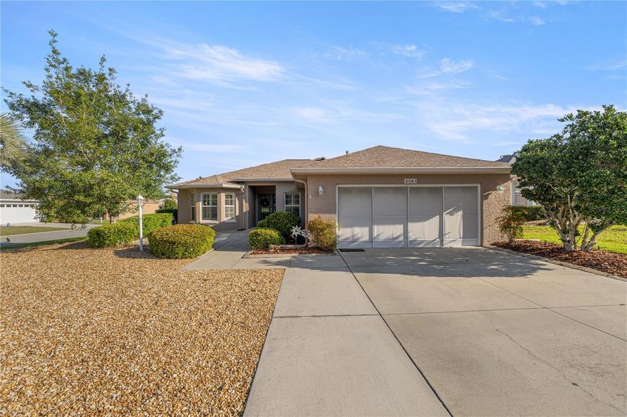 Walk into this beautiful corner lot home through its inviting entryway into a spacious living room, where recessed lighting, two skylights, and an open flow lead you to a beautifully updated kitchen. The main open areas have laminate and tile flooring, while bedrooms have carpet for comfort. The kitchen features Forevermark soft-close cabinets with dividers, granite countertops, a double pantry with pull-out shelving, over/under cabinet lighting, a drinking water purifier under the sink, and a cozy eating nook. The living room has extra-wide sliding glass doors and is plumbed for gas if you’d like a chimney leading you to the enclosed lanai, heated and cooled, complementing patio w/ birdcage for added living, relaxing and entertaining. The primary suite offers a tray ceiling, ceiling fan, and a walk-in closet with a built-in shelving system. Ceiling fans and lights are found throughout the home. The primary bath has quartz countertops and dual sinks. The front bedroom has a bay window with plantation shutters, and the guest bath includes a deep tub. Don’t miss the mudroom between the garage and kitchen, featuring a bar and extra storage cabinets. The garage houses the washer/dryer with generous cabinet and counter space. Ample storage throughout the home and garage. This home shows like a brand-new upgraded model—you don’t want to miss it! The Verbina model, on owned property, includes a low-maintenance rock yard, a Ring doorbell with motion light, a whole-house water softener/purifier, and a 3-year transferable HVAC and systems warranty.