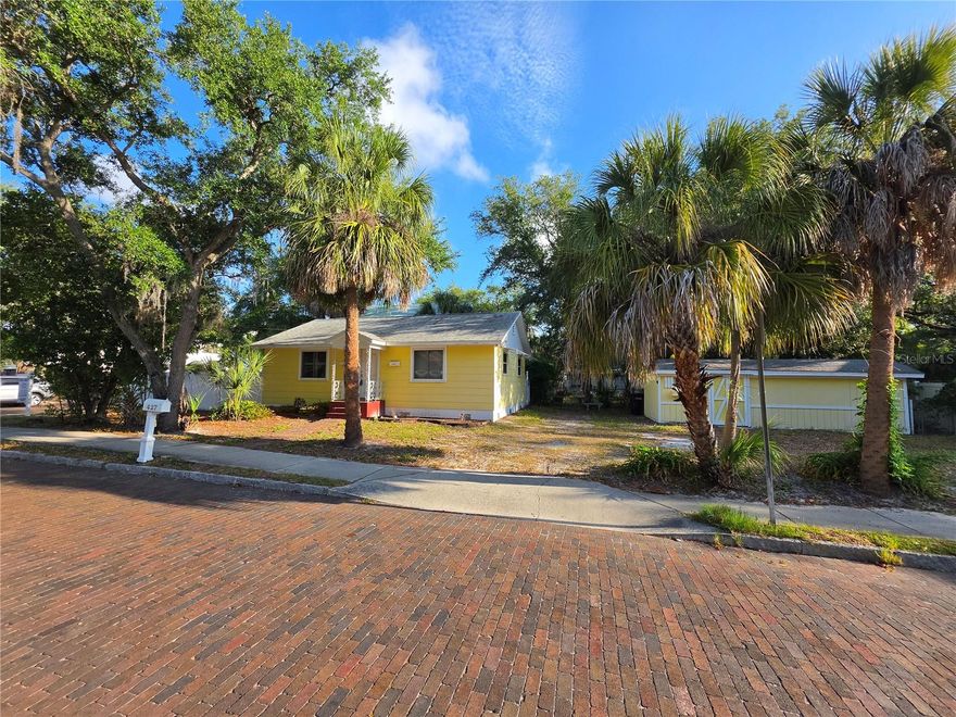 One or more photo(s) has been virtually staged. Unbeatable Location, Large corner-lot cottage home .3 miles from town center, in desirable Safety Harbor offering character, comfort, and many recent updates. Inside, the home features beautiful real wood floors, plantation shutters, custom built-in bookshelves, and warm wood accents that create an inviting and timeless living space. The kitchen open kitchen and dining room combo makes everyday living and entertaining comfortable and functional. Both bedrooms feature wood flooring and plenty of natural light, providing cozy and flexible spaces for rest, work, or guests. The updated bathroom includes new tile, a new vanity, updated fixtures, and a refreshed shower/tub stall for a clean and contemporary feel. Important system upgrades add peace of mind, including a 2022 Trane A/C, tankless water heater, newer electrical panel, and new front and back doors installed in 2024. Outside, enjoy a fully fenced backyard perfect for pets, gardening, or relaxing outdoors. The property also features a storage shed, extra off-street parking, and a convenient rear access ramp. Located less than half mile to walkable downtown Safety Harbor and the waterfront, residents enjoy easy access to parks, a marina, local restaurants, boutique shops, year-round festivals, and the famous Safety Harbor Resort and Spa. Experience the charm and relaxed coastal lifestyle that make Safety Harbor one of Tampa Bay’s most sought-after communities.