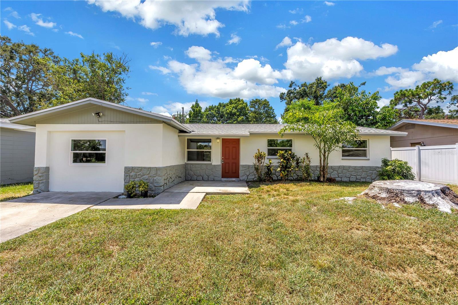 Welcome to this beautiful, move-in ready 4-bedroom, 2-bathroom home, ideally located in the heart of Largo! This light and bright residence features a spacious split-bedroom floor plan, designed for both comfort and functionality. Tile floors run throughout the entire home, offering durability and easy maintenance. The large kitchen boasts granite countertops, plenty of cabinetry for all your storage needs, and brand-new appliances—perfect for anyone who enjoys cooking and entertaining. Fresh interior paint enhances the home’s airy, modern feel. Both bathrooms are well appointed and feature walk-in showers for a sleek, modern touch. Step outside to a covered back porch and a fully fenced backyard, ideal for pets, outdoor dining, or simply relaxing. The location is unbeatable—just 10 minutes from the stunning Gulf beaches, with easy access to coastal living. You’re also close to local favorites like the Florida Botanical Gardens, Pinellas Trail, and Walsingham Park. Plus, you're minutes from shopping, dining, and Largo Mall, with quick connections to both St. Petersburg and Clearwater. Don't miss your chance to lease this charming home—schedule your showing today!