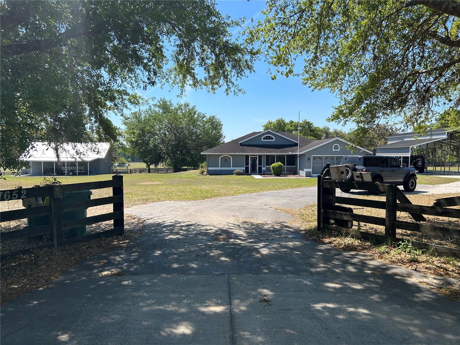 Welcome home in Floral City, this property is amazing! The main home sits on 3 acres of beautiful maintained land. It also has an income producing property that is a two bedroom one bath home towards the left back side of the property. In addition to the main home and income property it has a pole barn for an RV plus two additional vehicles. It also has two storage units on the back of the property. This is a very quiet area so if you are looking to get away and have your own slice of heaven this is the place! Inside the main home is a split floor plan with the main area open concept from living area, dinning and kitchen. Screened in porch in the front and screened in porch in the back for enjoying the scenic views of the rolling hillside in the back of the property. Come see this beautiful home, call today to schedule a showing!