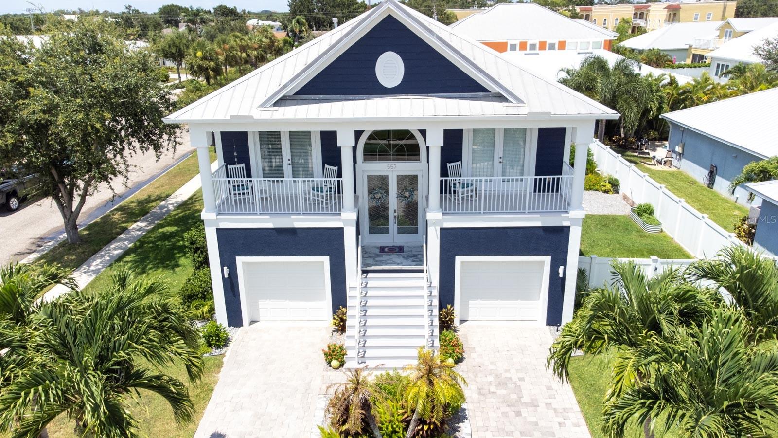 Apollo Beach Perfection in Gated Bimini Bay! Welcome to this impeccably maintained 4-bedroom, 2.5-bath, 2-story pool home! 2,326 sq. ft. of refined living space, perfectly positioned on a lushly landscaped corner lot! From the paver driveway & metal roof, to the vibrant tropical curb appeal, this home exudes quality and pride of ownership! Step inside to the inviting foyer & split-level stairs to this gorgeous home’s interior! With gleaming travertine tile throughout the entire home to the soaring ceilings, it’s a layout designed for both everyday comfort and entertaining! The spacious kitchen is a chef’s delight, offering quartz countertops, 42" wood upper cabinetry with crown molding & under-cabinet lighting, a farmhouse sink, Whirlpool stainless steel appliances, a breakfast bar, and an abundance of prep space! French doors provide access to one of the upper balconies, allowing for fresh air, cool breezes, and natural light! The upper-level living room flows seamlessly to a large rear balcony through triple glass sliders, framing views of the newly built heated saltwater pool, spillover spa, vinyl privacy fenced backyard & lush landscaping! Here, you can enjoy breathtaking sunrises and sunsets with the ideal north-facing rear and sweeping sun exposure! Equipped with (2) electric, remote-controlled, SPF roll-up screens, creating a comfortable spot to relax & enjoy year-round! The primary suite, also with rear balcony access through double glass sliders, is a private retreat featuring a custom wood closet system with an expansive dedicated shoe rack, and a spa-like ensuite bath with dual sinks, a garden tub, a private water closet, and a beautiful tumbled travertine walk-in shower! A 2nd upper level bedroom wood make an ideal office for your work or study, and also features a French Door opening to another balcony! There's also a convenient powder bath for your holiday, dinner, and party guests, as well as a laundry room (2025 LG dryer & 2023 LG washer included!) with direct access to the primary suite for even more added convenience! The lower level offers a spacious 300SqFt (20x15) great room that opens directly through triple glass sliders as well, onto the covered lanai, pool, and pool deck! This additional superb relaxation spot ALSO is equipped with (2) of those electric remote-controlled SPF screens! Two additional generously sized secondary bedrooms share a full bath with direct pool access, making it a perfect layout for guests or multi-generational living! Some of the numerous, and I mean NUMEROUS, other recent updates & additions include: new attic insulation, gutters & downspouts, all new window screens, updated lighting and bath fixtures, an EV NEMA 14-50 charging outlet, new garbage disposal, undercabinet lighting, and all new kitchen receptacles! Too much even to list here!! Living in coveted Bimini Bay means you get to enjoy gated security, and a community clubhouse & pool, all within minutes of everything captivating Apollo Beach has to offer! Marinas, waterfront dining, shopping, golfing, parks & recreation, Apollo Beach Waterfront Nature Preserve, and easy access to Tampa Bay, Sarasota’s award-winning beaches and beyond! Whether you’d like to host poolside gatherings or BBQ’s, savor a quiet cup of morning coffee or evening cocktail on one of the balconies, or maybe take an evening walk through this peaceful neighborhood…. this home offers you the ultimate Florida lifestyle! Call And Schedule Your Private Tour Today!