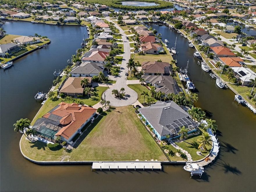 PRICED COMPETITIVELY! PRIME WATERFRONT KEY LOT! GREAT LOCATION IN BURNT STORE ISLES WITH SAILBOAT ACCESS TO CHARLOTTE HARBOR LEADING TO THE GULF! 140' of waterfrontage with huge linear footprint for boats on wide deep turning basin and gorgeous intersecting canal water views! Cleared and buildable with concrete seawall and 24' dock ready to add a lift plus plenty of room for a pool. This stunning waterfront lot offers everything! Don't settle for anything but the best when you're going to build your dream home! Popular boating and golf community close to Twin Isles Country Club offering golf, tennis, fine dining and many social events plus just a short ride to beautiful historic downtown Punta Gorda with arts, community events and entertainment. Amazing location with immediate access to world class fishing/boating, beautiful parks and all amenities SWFL has to offer. Other lots are available. Don’t miss this opportunity!