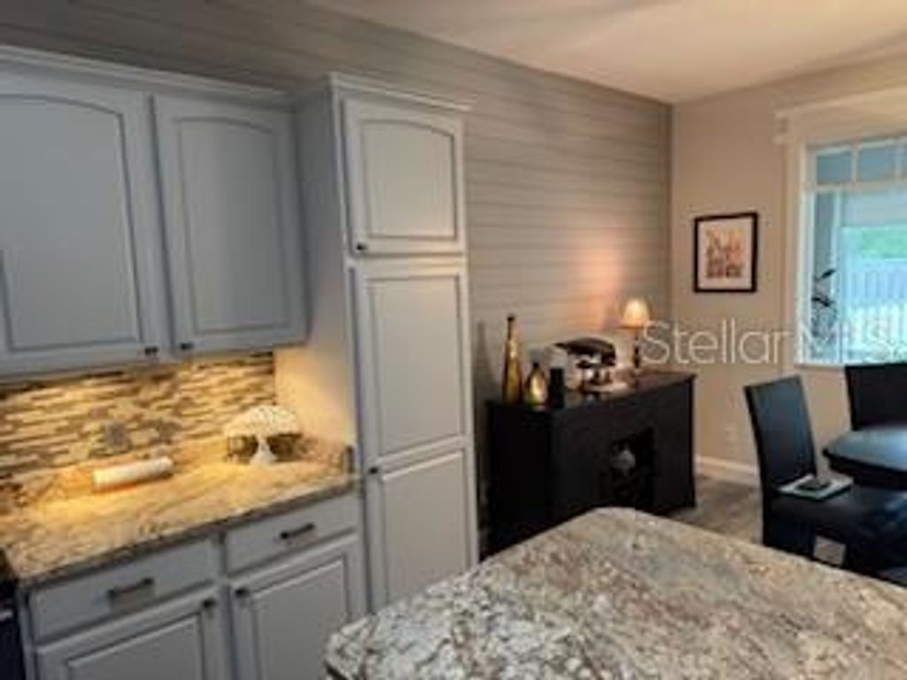 Photo of 11888 SE 91st Circle, Summerfield, FL 34491 (MLS # OM716472)