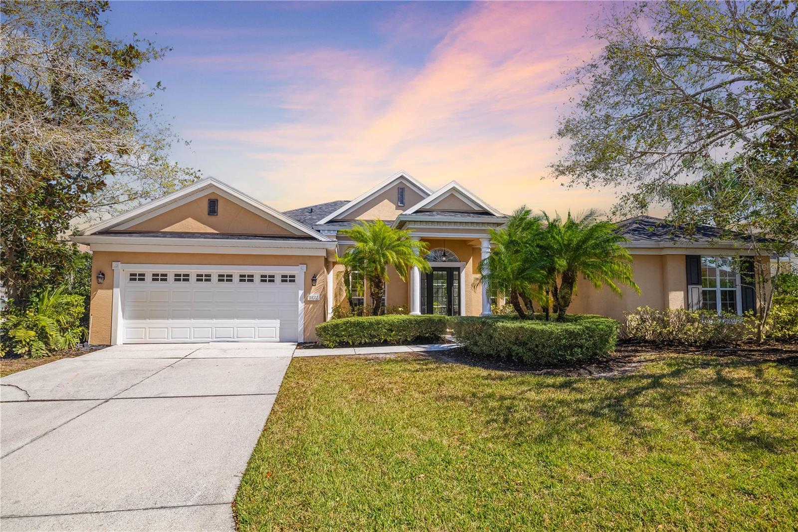 Discover this stunning 4-bedroom, 3-bathroom Neal Built home with a bonus room, offering nearly 3,000 square feet of luxurious living space in the exclusive gated community of University Place. The chef-inspired kitchen boasts ample counter space, a large center island, stainless steel appliances, and a pass-through perfect for entertaining guests in the formal dining room. The spacious primary suite features a sitting area, dual closets, and an elegant bathroom with separate vanities, a soaking tub, and a separate shower.
Enjoy soaring 12-foot ceilings with crown molding, gorgeous 20-inch diagonal tile, and beautifully updated engineered hardwood floors throughout. The roof is only 1 year old, and the AC was replaced in 2020. The expansive lanai and private pool area provide an ideal setting for outdoor relaxation and entertaining.
Bedrooms 2 & 3 share a bathroom with a convenient pocket door for added privacy, while Bedroom 4, located at the rear of the home, shares a bath with the bonus room/office space and doubles as a pool bath.
University Place offers incredible amenities, including an on-site fitness center, two outdoor kitchens with natural gas grills, and scenic walking trails around serene lakes with lit fountains. Charleston-inspired street lamps and flower baskets add to the charm of this well-maintained community.
Location could not be any better! Situated in the heart of Sarasota/Bradenton, this home provides quick access to the world-renowned Siesta Key Beach, premier shopping and dining at UTC Mall, and top-rated golf courses, tennis, and pickleball facilities. Experience the ultimate in Florida living with this executive-style home in one of the area’s most coveted gated communities. Don’t miss this rare opportunity!