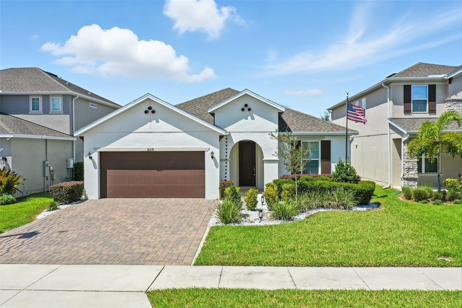 This thoughtfully designed home in one of the fastest growing communities near Orlando features a desirable split floor plan that includes a Jack-and-Jill bathroom, providing both comfort and functionality. The open kitchen is highlighted by upgraded countertops and cabinetry, a walk-in pantry, and a large island, making it ideal for everyday living and entertaining. A spacious laundry room adds convenience, while the two-car garage with epoxy flooring offers durability and style. Outdoor living is enhanced by a paver patio overlooking a wetland with no rear neighbors, providing added privacy and a peaceful backdrop. The landscaped beds include upgraded rock accents for a polished look. Located close to new shopping and amenities, this home combines modern finishes with a prime location, offering an excellent opportunity to enjoy Central Florida living.