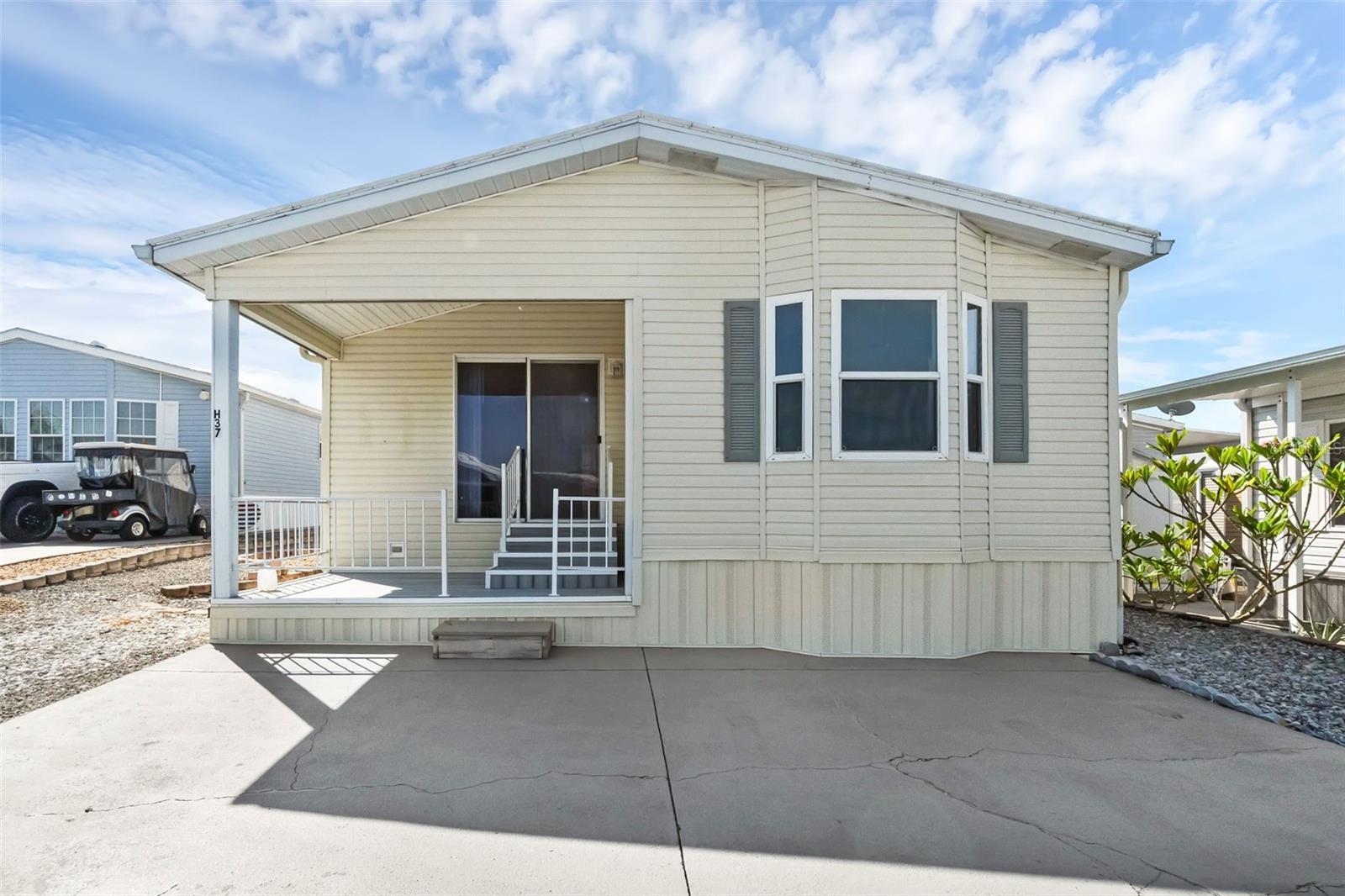 Welcome to West View Ridge, where resort-style living meets everyday comfort. This immaculately maintained 2-bedroom, 1-bathroom manufactured home is located in a golf cart-friendly 55+ community, and best of all — you own the land.
Inside, you’ll find spotless wood laminate floors, a vaulted ceiling in the living room, and an abundance of natural light streaming through the south-facing sunroom and large bay window in the kitchen. The separate dining area offers a cozy space for meals, while the inviting front porch and beautifully maintained landscaping create a relaxing, tropical island feel. The spacious driveway and easy-care rock landscaping add convenience to the charm.
Residents of West View Ridge enjoy a wide array of amenities including a solar-heated pool, recreation hall, mini putt-putt golf, shuffleboard, pickleball, bocce ball, and so much more. The community is ideally located near restaurants, medical facilities, shopping, and major roadways, providing quick access to Florida’s top attractions and the stunning beaches on both the east and west coasts.
This is your chance to enjoy peaceful, resort-style living in an immaculate, move-in-ready home. Don’t miss out!