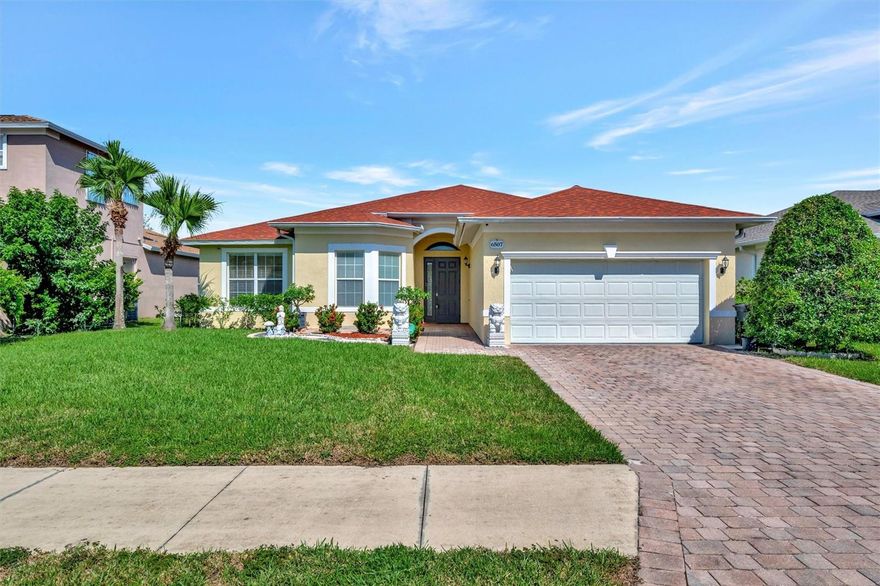 This spacious 3 bedroom, 2 bathroom home offers a versatile layout with additional room that can serve as a home office, play nook, or formal dining room. The kitchen features a breakfast bar and eat-in space, opening to a large oversized family room perfect for gatherings. The primary suite is tucked privately at the back of the home, complete with a garden tub, dual vanities, and a separate shower. Two guest bedrooms share a bathroom designed with a private commode and shower room for added convenience. Additional highlights include an indoor laundry room with washer/dryer provided, a large garage with fresh epoxy floors, and the entire home painted in a light coastal hue, all set for your upcoming move! The backyard provides a tranquil setting ideal for potted plants or a zen garden, while the community offers a refreshing pool for residents to enjoy.