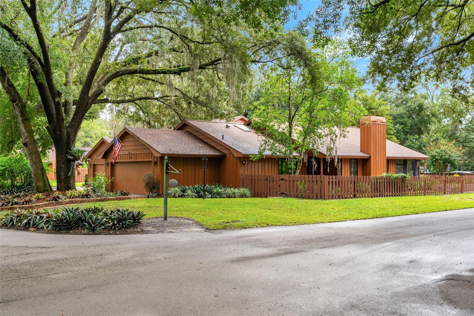 One or more photo(s) has been virtually staged. Welcome home to this impeccably maintained and well-loved residence, cherished by the same owner since it was custom built on this corner lot. This extraordinary gem is tucked away in the heart of Oviedo in a quaint, tree-lined neighborhood. From the moment you walk in, you’ll feel the welcoming vibe with an open-concept living and dining room accented by skylights and Saltillo tile throughout, reflecting exceptional attention to detail and quality. A cozy wood-burning fireplace adds even more charm. The kitchen features custom wood cabinetry and pantry, granite countertops, and a large picture window that fills the space with natural light. The spacious primary suite offers cathedral ceilings, a walk-in closet, and a private ensuite with a garden tub, separate shower, and dual sinks. Two additional bedrooms are located in their own private wing, with the recently updated second bathroom featuring designer Brizo fixtures. Plantation shutters have been added throughout the home and bring an added touch of class. The updated double-paned windows and doors keep the home quiet and energy efficient. A sliding glass door off the living room leads to a screened patio and beautifully landscaped yard, perfect for relaxing or entertaining. The laundry room is conveniently located just off the kitchen. Major updates include: new roof (2025); new exterior doors and Andersen windows (2023); water heater (2022); electrical panel (2023); exterior paint (2025); and refrigerator (2025). The community offers a pool and tennis courts, with an HOA run by the homeowners. This prime location is just minutes from shopping, dining, grocery stores, A-rated schools, the Seminole County trail system, and FL-417. Come see it for yourself!