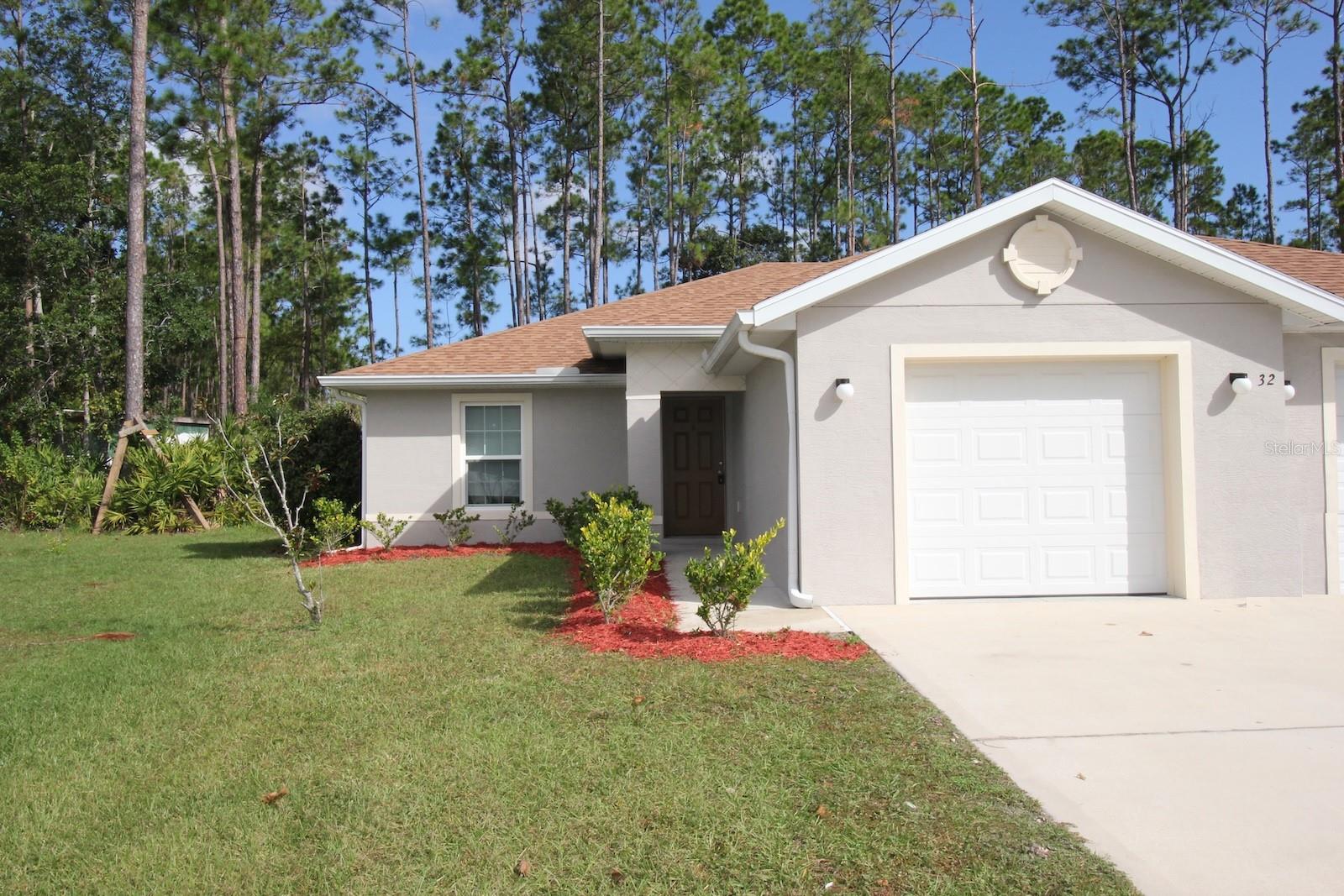 Gorgeous 3 Bed 2 Bath 1 Car Garage duplex home was BUILT IN 2018.. Side B, features a roomy design. Enjoy the benefits of a newer, energy efficient design of this home. The home features LED lighting, tile throughout, granite countertops, fans with integrated lights in each bedroom, automatic garage door opener, tile back splash in the kitchen and much more. Enjoy entertaining in your private covered lanai, which will be screened for added comfort. The very private backyard backs up to a designated reserve. Excellent location situates this home close to everything Palm Coast has, including shopping, schools, entertainment, parks, Town Center, and much more. Easy access to the main roadways and the I95 allows for speedy commute to both Daytona or Jacksonville as well as the local beaches! LAWN CARE INCLUDED!