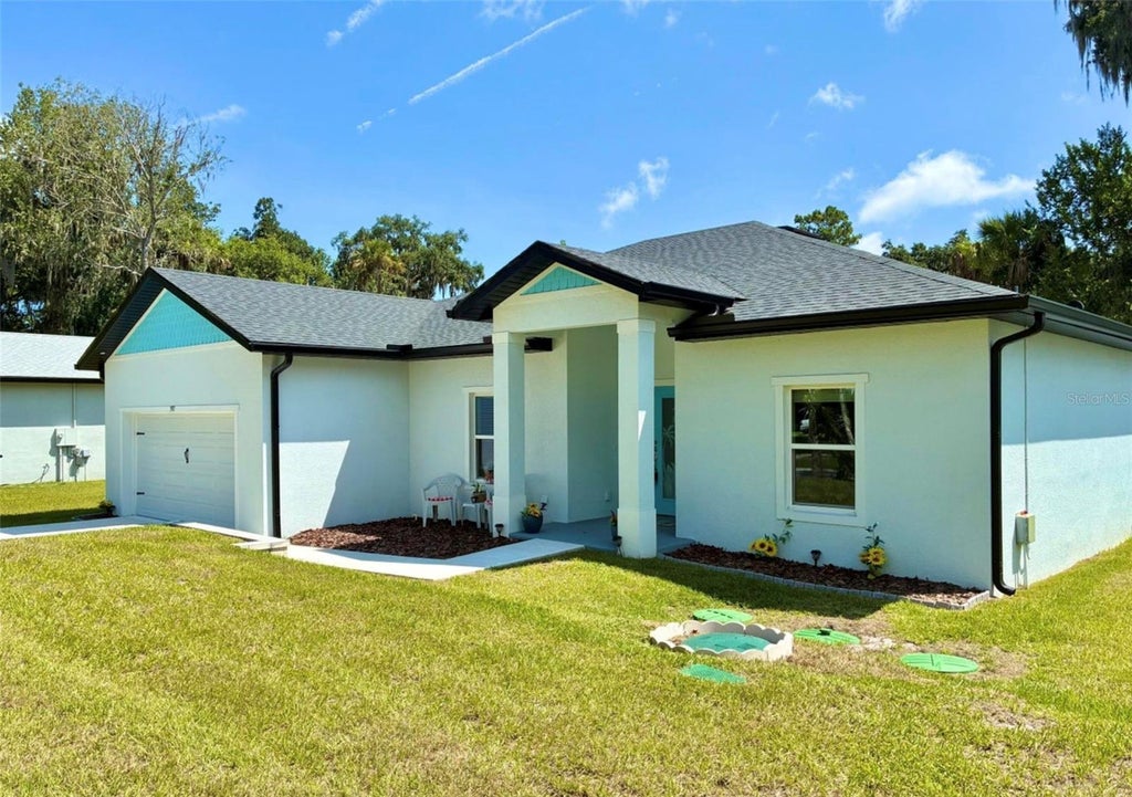 Photo of 397 Palm Drive, New Smyrna Beach, FL 32168 (MLS # FC322295)