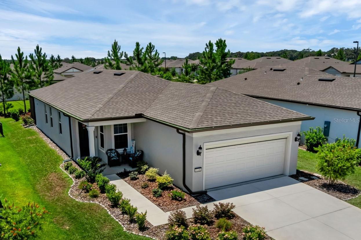 Whether you're escaping the cold or looking for a year-round haven, this thoughtfully designed 2-bedroom, 2-bath home with an office/study is your gateway to Florida’s ideal 55+ lifestyle. Located in the sought-after, gated community of Stone Creek, this gently lived-in, two-year-old home delivers comfort, convenience, and a vibrant sense of community — all wrapped in a low-maintenance package.
Step inside to find a spacious, light-filled interior where 10-foot ceilings and 8-foot doors create a bright, open atmosphere. The heart of the home is the kitchen, outfitted with quartz countertops, subway tile backsplash, soft-close cabinetry with pull-out shelving, and a large center island with breakfast bar — all appliances are included. Whether you're hosting family or simply enjoying a quiet evening, this space was designed to make everyday living easy and enjoyable.
The split-bedroom layout offers privacy and flow, with a tranquil primary suite featuring a tray ceiling, custom walk-in closet system, and a beautifully appointed en-suite bath with quartz counters and a ceramic-tiled walk-in shower. The second bedroom is perfect for guests, while the office/study — complete with custom built-ins for display, file storage, and workspace — is ready to accommodate your hobbies, tech needs, or reading retreat.
When it’s time to unwind, the spacious screened lanai is the perfect place to gather, grill, or relax. A brand-new 16-foot SunSetter awning with a wind sensor provides shade and protection at the touch of a button, extending your living space outdoors in all seasons.
And while the interior is inviting, the garage is equally well-planned — with a motorized screen door, ceiling-mounted storage racks, and pre-plumbing for a water treatment system. This isn’t just a place to park your car; it’s a practical extension of the home, thoughtfully outfitted for everyday ease.
Additional upgrades include a commercial-grade 50-gallon water heater, in-wall pest control tubes, full rain gutters, and clean, modern finishes throughout. The HOA fees remain surprisingly reasonable, especially considering the exceptional amenities and maintenance-free perks that come with living in a community of this caliber.
Life in Stone Creek is built around freedom and connection. Enjoy endless options for recreation and relaxation with a full suite of amenities, including an 18-hole championship golf course, fitness centers, indoor and outdoor pools, tennis and pickleball courts, walking trails, clubs, social events, and an arts and crafts center. There's even a secure RV and boat storage area for those who love to hit the road or explore the waterways.
This home is ideal for active singles or couples ready to trade snow shovels and home upkeep for sunny skies, great golf, and a lifestyle that’s as energetic — or relaxed — as you want it to be. Whether you're looking for a seasonal home base or a full-time retreat, Stone Creek offers the perfect backdrop for your next chapter.