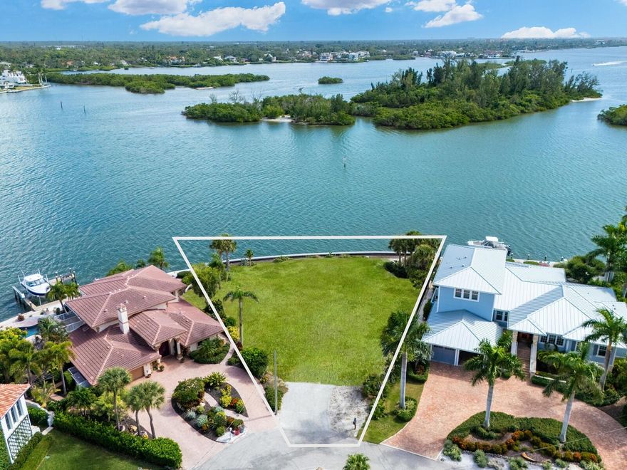 This waterfront gem fronts Roberts Bay, facing Edwards Island, and offers unobstructed 180-degree views of dolphins, various bird species, and manatees. It's a perfect canvas for creating your customized residence. Located on the prized northern tip of Siesta Key, nestled on the Freeling Drive peninsula, this exquisite parcel blends sophistication with coastal living. Bay Island is renowned for its admired homes and architectural beauty, redefining island luxury along one of the area’s most pristine waterways. The oversized homesite is just under 15,000 square feet and features an impressive 155 feet of brand-new two-foot-elevated seawall, offering stunning panoramas. This location is ideal for boating and fishing enthusiasts, or for simply enjoying breathtaking sunrises and sunsets in unmatched natural beauty. Access on and off the island is easy, with Siesta Key Village's vibrant shops and restaurants, as well as the world-renowned Siesta Key Beach, just minutes away. Downtown Sarasota, with its galleries, theater, and fine dining, is also a short drive. Opportunities like this are rare, making this property a true gem for anyone seeking the ultimate waterfront address where privilege and prestige are embedded in an affluent lifestyle. I highly recommend experiencing the magic of this property for yourself. Choose any architect or builder to make your dreams come true. Owner will consider financing.