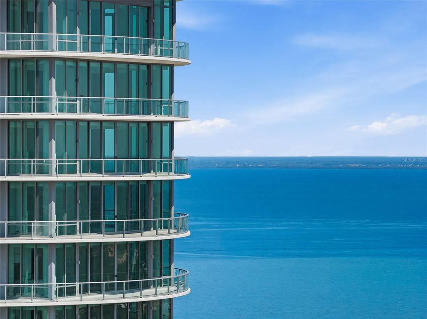 Perched on the 35th floor of The Residences at 400 Central — the tallest residential tower on Florida's Gulf Coast — this designer-upgraded 3-bedroom, 3-bath sky home captures what only a handful of residences in the building can: sweeping panoramas of Tampa Bay, the downtown skyline, and fiery Gulf sunsets, all from a single residence. Floor-to-ceiling windows frame every view, and 10-foot ceilings amplify the sense of space and light throughout the open floor plan.
Thoughtful upgrades set this home apart from the builder-spec inventory in the tower. Light-toned wide-plank wood cabinetry adds warmth throughout, custom tile backsplashes crown the vanities in the spa-inspired Italian-tile baths, and the chef's kitchen pairs quartz countertops and European-style cabinetry with a gas range. Move-in ready, with nothing left to do.
Two parking spaces convey, including one of only ten coveted second-level spots featuring key-fob security access and a private EV charging station — an exclusive perk unavailable to most residences — plus a dedicated valet space.
Residents enjoy a full complement of resort-caliber amenities: a sun-drenched pool deck with private cabanas, a state-of-the-art Technogym fitness center with dedicated yoga and functional training studios, a private residents' lounge, game room, co-working suite, boardroom, and the crown jewel — a 46th-floor Sky Lounge with panoramic observation terraces. A 24-hour concierge, ground-floor retail and restaurants, and unmatched walkability to the best of downtown St. Pete complete the lifestyle.
Rarely does an opportunity emerge at this elevation with this level of finish, this configuration of parking, and this price. This is the top of St. Pete — elevated living, effortlessly delivered.
Walking distance to some of the best restaurants St. Pete has to offer, with a Michelin Guide Restaurant across the street.