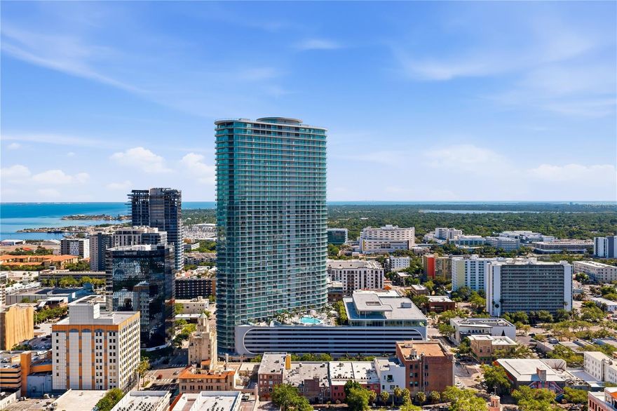 At $2,375,000 (~$1,219/sqft), #3506 is the sharpest per-sqft value of any high-floor 3BR currently active in the tower. Direct comps from the CMA: #3606 — one floor up, identical 06 plan — sits at $2,425,000 with 54 days on market; #3401 is at $3,295,000; #4002 at $4,885,000. With 28 active listings in the building, the differentiation story is built around (1) value-at-elevation vs. units a few floors up, (2) tri-directional bay/skyline/Gulf-sunset exposure, (3) designer upgrades already in place, and (4) the rare second-level key-fob EV parking space.

Two parking spaces convey, including one of only ten coveted second-level spots featuring key-fob security access and a private EV charging station — an exclusive perk unavailable to most residences — plus a dedicated valet space. Residents enjoy a full complement of resort-caliber amenities: a sun-drenched pool deck with private cabanas, a state-of-the-art Technogym fitness center with dedicated yoga and functional training studios, a private residents' lounge, game room, co-working suite, boardroom, and the crown jewel — a 46th-floor Sky Lounge with panoramic observation terraces. A 24-hour concierge, ground-floor retail and restaurants, and unmatched walkability to the best of downtown St. Pete complete the lifestyle. Rarely does an opportunity emerge at this elevation with this level of finish, this configuration of parking, and this price. This is the top of St. Pete — elevated living, effortlessly delivered. Walking distance to some of the best restaurants St. Pete has to offer, with a Michelin Guide Restaurant across the street.