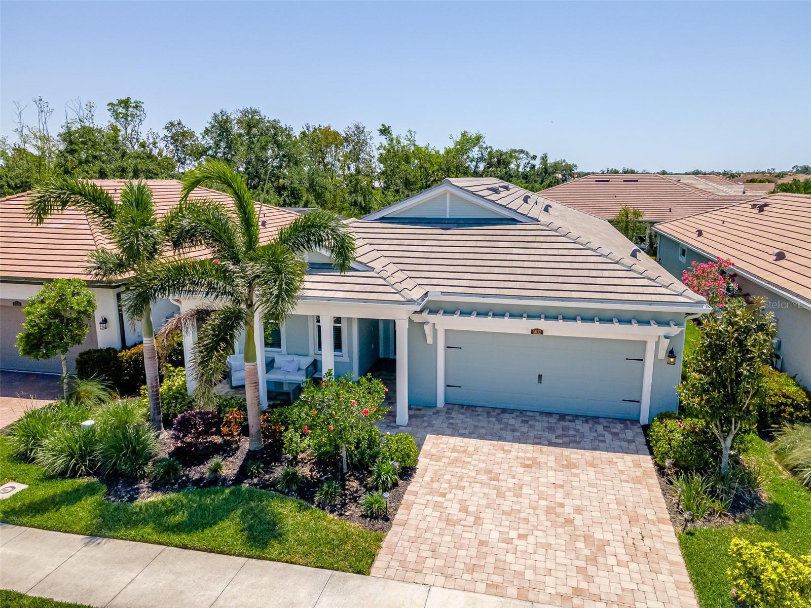 Back on market due to buyer financing. Welcome to Sunrise Preserve, an exclusive gated community perfectly situated adjacent to Palmer Ranch and just 7.4 miles away from World Famous white sandy beaches of Siesta Key. Discover elegance and modern living in this stunning Dayspring model with 3BR, 2BA, offering over 2,298 sq ft of living space with hurricane impact windows and doors throughout perfectly crafted for your comfort and grants you access to a myriad of luxury amenities that Sunrise Preserve has to offer. Upon entering, be greeted by a spacious entryway with timeless finishes leading into a realm of sophistication. Every detail has been designed with upgrades in mind, featuring gorgeous porcelain tile flooring, intricately designed tray/coffered ceilings with crown molding, and grand 8' doors that exude elegance. The show stopping gourmet executive chef’s kitchen is a culinary masterpiece, boasting 42" cabinetry, stunning oversized island with beautiful quartz countertops, a natural gas range, double ovens and a large walk-in pantry. The heart of the home overlooks the dining area and great room, offering an ideal space for both culinary creations and entertaining guests. You'll love the sliding glass doors that take you out to the custom-built pool with waterline tile and a wet edge pebble finish offering a private oasis for relaxation and fun. Retreat to the Owner’s Suite, a sanctuary in itself, with a luxurious en-suite bathroom that includes dual vanities, an exquisite oversized shower, a private water closet, and his & hers walk-in closets. The home also features a spacious 2-car garage with sleek epoxy floors and enjoy the peace of mind provided by the hurricane impact windows throughout, ensuring durability and safety. This Smart Home is equipped with upgraded fixtures, ceiling fans, recessed lighting, 9'4" ceilings that seamlessly blend technology with comfort. The ground maintenance and irrigation included in the low HOA fee, ensuring your home’s exterior stays pristine year-round along with a whole home built-in Taexx system for pest control. Best of all, it’s not in a flood zone and there are no CDD fees to worry about. Dive into relaxation as privacy shades offer a serene atmosphere around the pool with an additional view of a beautiful preserve. Sunrise preserve offers a spectacular 5,000 square foot clubhouse, a fully equipped fitness center, and a resort-style 'zero entry' pool with spa, ideal for relaxation. For the active lifestyle, enjoy 2 tennis courts, 2 pickle ball courts, and 2 bocce courts. The clubhouse features a gathering room, lounge, and a State-of-the-Art Gourmet Community Kitchen with a Guest Bar. Sunrise Preserve also has an amenities director coordinating a monthly calendar of social and sporting activities, parties with music, game nights and evenings with food trucks. Entertain guests in the grill/fire pit areas and experience the vibrant, active community surrounded by endless shopping, dining, and entertainment opportunities. Minutes away is the legacy trail that runs from Sarasota to Venice or enjoy the in community walking trails. This home is not just a place to live—it's a lifestyle.