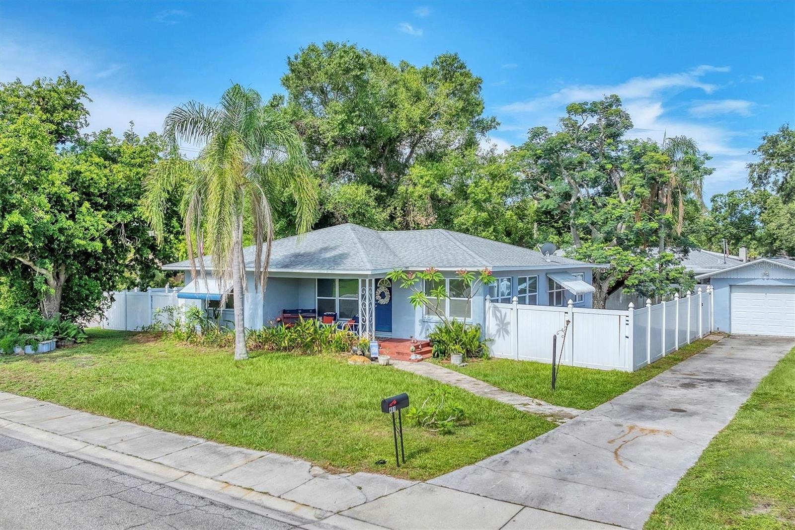 This delightful 1940s home blends vintage character with thoughtful updates in a highly sought-after Sarasota setting. Featuring two bedrooms, one beautifully renovated bathroom, a dedicated laundry room, and a flexible bonus space ideal for a home office, den, or creative studio, the layout offers both comfort and versatility. Original wood floors run throughout the main living areas, complemented by brand new luxury vinyl tile in the kitchen, flex space, and laundry room for a modern, low-maintenance touch. Situated on nearly a quarter-acre corner lot, the property is fully fenced with durable vinyl fencing offering privacy, security, and room to roam. A large paver patio provides the perfect setting for outdoor dining, entertaining, or simply soaking up the sunshine. The detached one-car garage adds extra convenience for parking, storage, or workspace, and no HOA means added freedom and flexibility. You’re just two miles from the Sarasota waterfront and minutes from downtown shopping, dining, and cultural attractions. Ideally located just blocks from the Pompano Trailhead featuring pickleball courts, basketball, a playground, and access to the Legacy Trail. You’ll also enjoy close proximity to Ed Smith Stadium and nearby sports fields, perfect for catching a spring training game or enjoying outdoor recreation. With timeless charm, valuable updates, and a location that combines convenience and lifestyle, this home is ready to welcome you.
