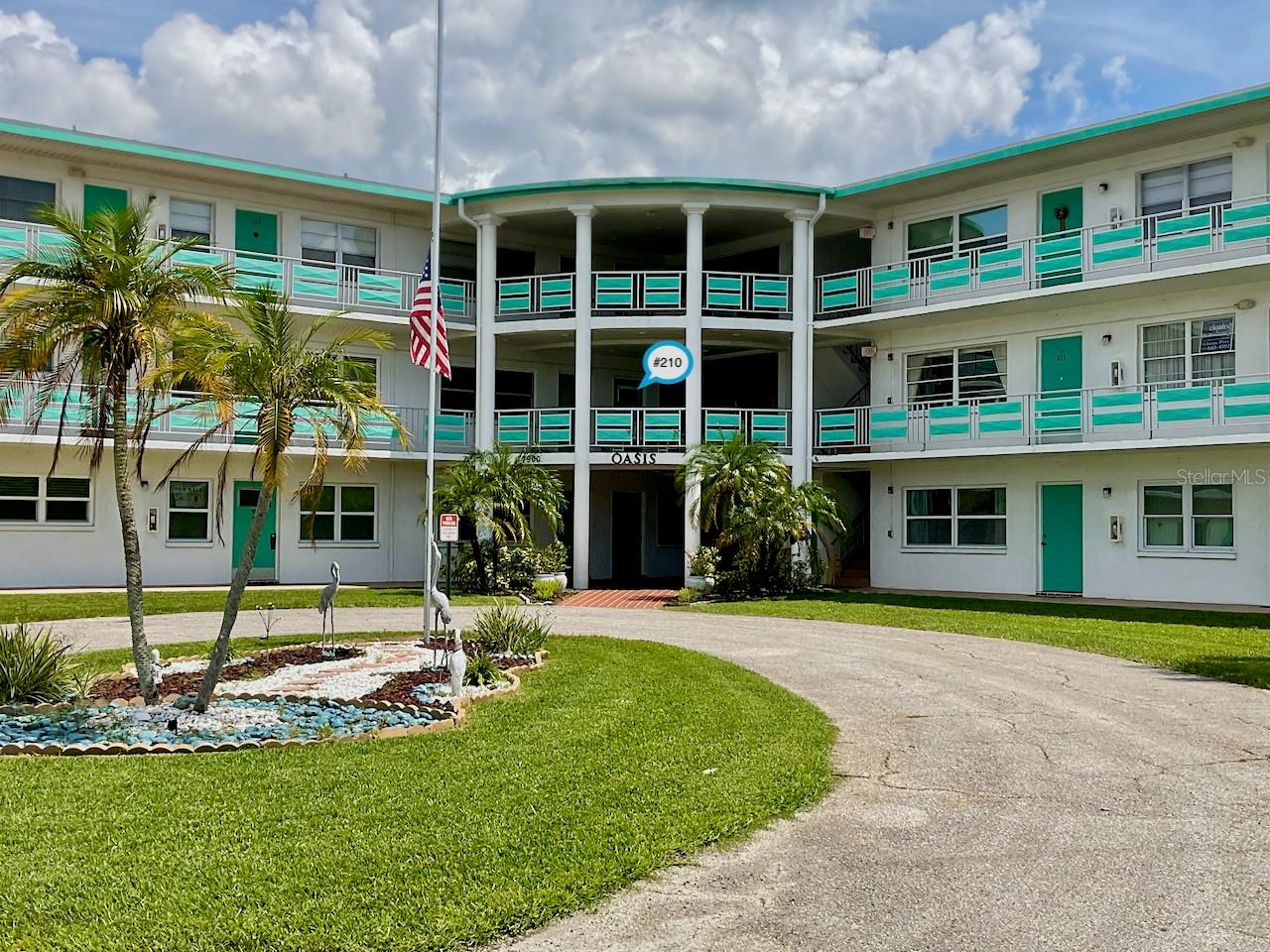 This is it! Check out this 2 bedroom, 2 bath, 1410 sq. ft. in the 55+ community in the Oasis Bldg. of the Town Apts. Condo. This end unit is one of the largest in the community and is located right next to the elevator. There is a covered front deck/porch area where you can sit and enjoy the view of the pond. As you enter the home, the living room has carpet that transitions to laminate flooring in the combined dining area. There is room for your dining table with chairs or just use the breakfast bar. The kitchen has tile flooring, stainless steel appliances, granite countertops, and a gas stove. Off the kitchen, there is a bonus room that could be used for a library, movie room, an office, or craft room. The large primary bedroom has an ensuite bathroom with a step-in shower and a slider to the bonus room. The guest bedroom has two closets and your own private entrance/exit door to the condo. The guest bathroom has been updated and has a tub/shower combo. Both bedrooms were updated in 2021 to laminate flooring. The community has a Rec Hall Clubhouse complete with shuffleboard court, a pool with patio, an additional large picnic patio area for cornhole and barbeques. In the clubhouse, there is a large event room, card room, library, and billiards room. Activities include Yoga and fitness classes. The condo fee includes: water, gas water heater, gas used for your stove and heating, sewer, trash, cable, internet, pool and ground maintenance, building maintenance, and a designated carport space. Located minutes to the Tampa International Airport, and close to downtown St. Petersburg's restaurants, museums, entertainment, and Vinoy Park on the bay. What more could you ask for! Call today to schedule you private showing at the Oasis.