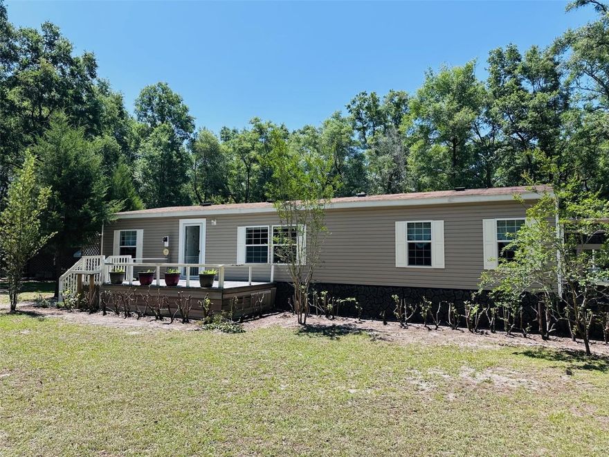 MOTIVATED SELLER! Back on your radar with updates you’ll love! This well-maintained 2009 3-bedroom, 2-bath double wide manufactured home sits on a peaceful 4.69-acre wooded lot in Chiefland, Florida—perfect for those looking for space, privacy, and convenience. A brand-new roof will be installed before closing, offering peace of mind to buyers. The 2019 HVAC system keeps the home comfortable year-round. Inside, you’ll find a large open kitchen with a breakfast bar, tons of cabinets, and generous counter space—great for gatherings and everyday living. The spacious primary suite features a walk-in closet, a garden tub, step-in shower, dual vanities, and even a hidden laundry chute for added charm and function! Enjoy the outdoors in your beautifully treed yard, ideal for gardening, pets, or simply relaxing. Located just minutes from schools, shopping, and restaurants, and only 15 minutes to the Suwannee River and 30 minutes to the Gulf. Whether you're searching for a country home, family retreat, or winter getaway, this one checks all the boxes. High-speed internet is available here. Zoned for site-built or manufactured homes. Schedule your private tour today!