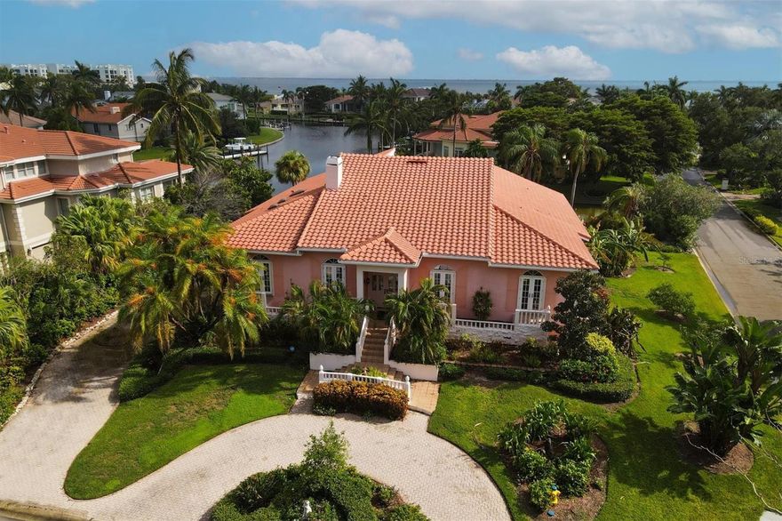 Envision yourself living in Paradise! That is Longboat Key with water everywhere and easy access to the amazing Gulf of Mexico * Bay Isles Harbor is double gated and a prime location to everything * Picture yourself living in this remarkable home * Dramatic entry with 24’ vaulted ceiling *The inviting Pool and glistening  water from the Canal is the first astonishing view when you walk in the front door * Boating out your back door * Step down to the Great room with a  sunken seating area and fireplace and built in bench for watching TV * You will have fun entertaining behind your marble wet bar *Large dining room with built-in mirrored cabinets for all your special china - crystal - linens * The Kitchen is easily accessible * The Nook has a pass through to kitchen and enjoys natural sunlight from the skylights above * All 3 bedrooms have access to the amazing Pool and Spa area * Master bedroom has vaulted ceilings and includes enormous Dressing room and Closet complete with many built-ins for organizing your wardrobe * The tropical foliage is seen from many windows and sends off a peaceful tranquil feeling* *From the lower level you will be steps away from jumping onto your boat and enjoying the Longboat Key Paradise experience *  This  home has 3 AC units and Barrel Tile Roof ,that was replaced in 2018 along, with 4 sets of newer French Doors in the front of the home* There is so much storage in this home including a partial basement *  Residents of Bay Isles enjoy access to Bay Isles Beach Club with it’s beautiful sandy beach and Gulf waters * This property is located close to St Armands Circle, Publix, CVS, and many wonderful restaurants.