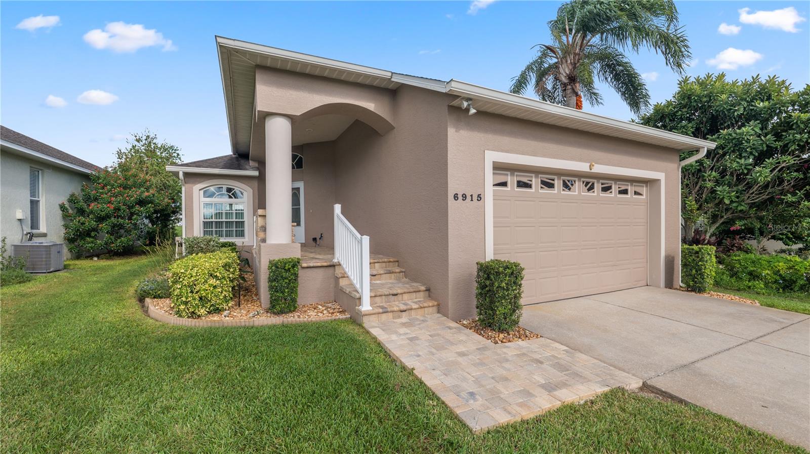 GOLF COURSE VIEW! Opportunity is knocking! Come view this beautifully maintained 3 bedroom 2 bathroom home and make it your full time residence or your winter home in beautiful Central Florida. Located within the beautiful Golf Course Community of Huntington Hills. Membership is not required but can be purchased separately. Enjoy the many community amenities including an 18 hold Championship Golf Course, dining, a clubhouse, a swimming pool, tennis, a fitness center, walking trails and a community park and a private lake with boat access! The community also features banquet facilities for events and a lounge with entertainment.
Additional home features you will appreciate: Many Brand New Anderson Windows at a cost of $20,000 were just installed, Extended screened back porch with golf course view, Engineered Wood Floors, Roof +/-7 yrs old, AC New in 2024, New rail, pavers and lighting on front porch. Golf Cart and furnishings are negotiable.