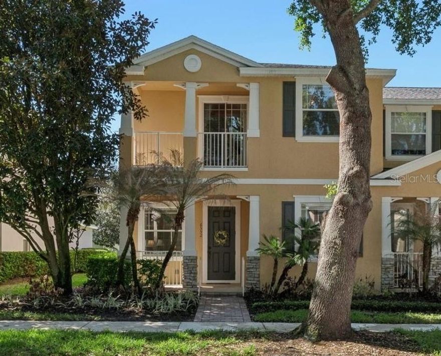 Welcome home to Preston Square in beautiful Windermere! This stunning corner-unit townhome with 4 bedroom, 3 bathrooms offers the perfect blend of comfort, style, and convenience, with a new roof and fresh exterior paint. Step onto the cozy front porch and into a bright, inviting two-story home filled with natural light. The main living areas feature tile flooring throughout; great room showcases a mirror accent wall along with board and batten in the dining area. Kitchen features granite countertops, breakfast bar, stainless steel appliances, and stone backsplash. Sliding glass door leads to a private paver patio, perfect for relaxing or entertaining. Downstairs bedroom with full bath, inside laundry room plus a utility sink leads to the attached two-car garage with long driveway for additional parking. Upstairs you will find 3 additional bedrooms, stunning primary suite with balcony views. Primary bath features dual sinks, large garden tub, and separate shower. Preston Square offers amenities including a stunning community pool, playground, mature landscaping, basketball court, green space for events, and fitness stations. Ideally located near local dining, shopping, top-rated schools, golf courses, hospitals, and major roadways and attractions.