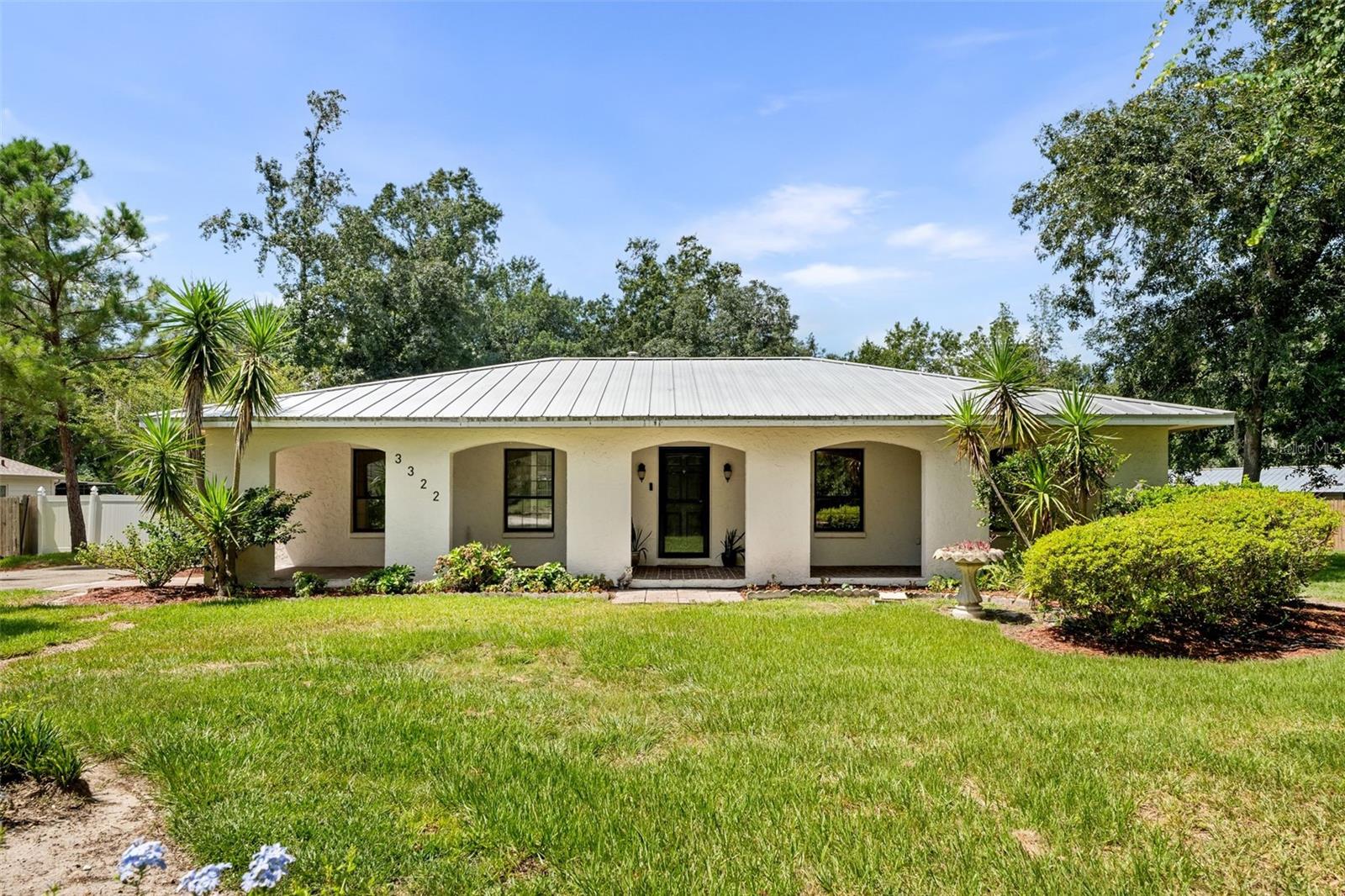 Proud to present this stunning 4-bedroom, 2-bath home that blends Spanish/Mediterranean-inspired charm with modern upgrades and thoughtful efficiency. Located in one of Gainesville’s most convenient and established neighborhoods, this property offers a rare combination of character, comfort, and smart living.
As you arrive, the home’s inviting curb appeal sets the tone for what’s inside. Step through the entry and you’ll find a beautifully renovated kitchen with clean, modern finishes, perfect for hosting or everyday family life. The master bathroom has also been recently updated, offering a private retreat with a fresh, contemporary feel. The interior is warm and welcoming, with natural light that spills into each room, and a layout that effortlessly balances open living with quiet personal space.
Outdoors, a spacious courtyard draped in muscadine vines creates a unique and relaxing gathering space. Just beyond, the private pool—complete with a recently replaced liner—offers the perfect spot to unwind or entertain. A utility and laundry room adds extra functionality, while a detached shed provides ample storage for tools or toys.
Efficiency is woven into every part of this home, with a seamless metal roof, thirty solar panels, a tankless water heater, and gas heating—all designed to reduce energy costs and increase long-term comfort. Every detail has been meticulously maintained and thoughtfully upgraded, creating a truly move-in ready experience.
Perfect for families or professionals seeking a home with both personality and practicality, this one-of-a-kind Gainesville property delivers both great lifestyle and location.