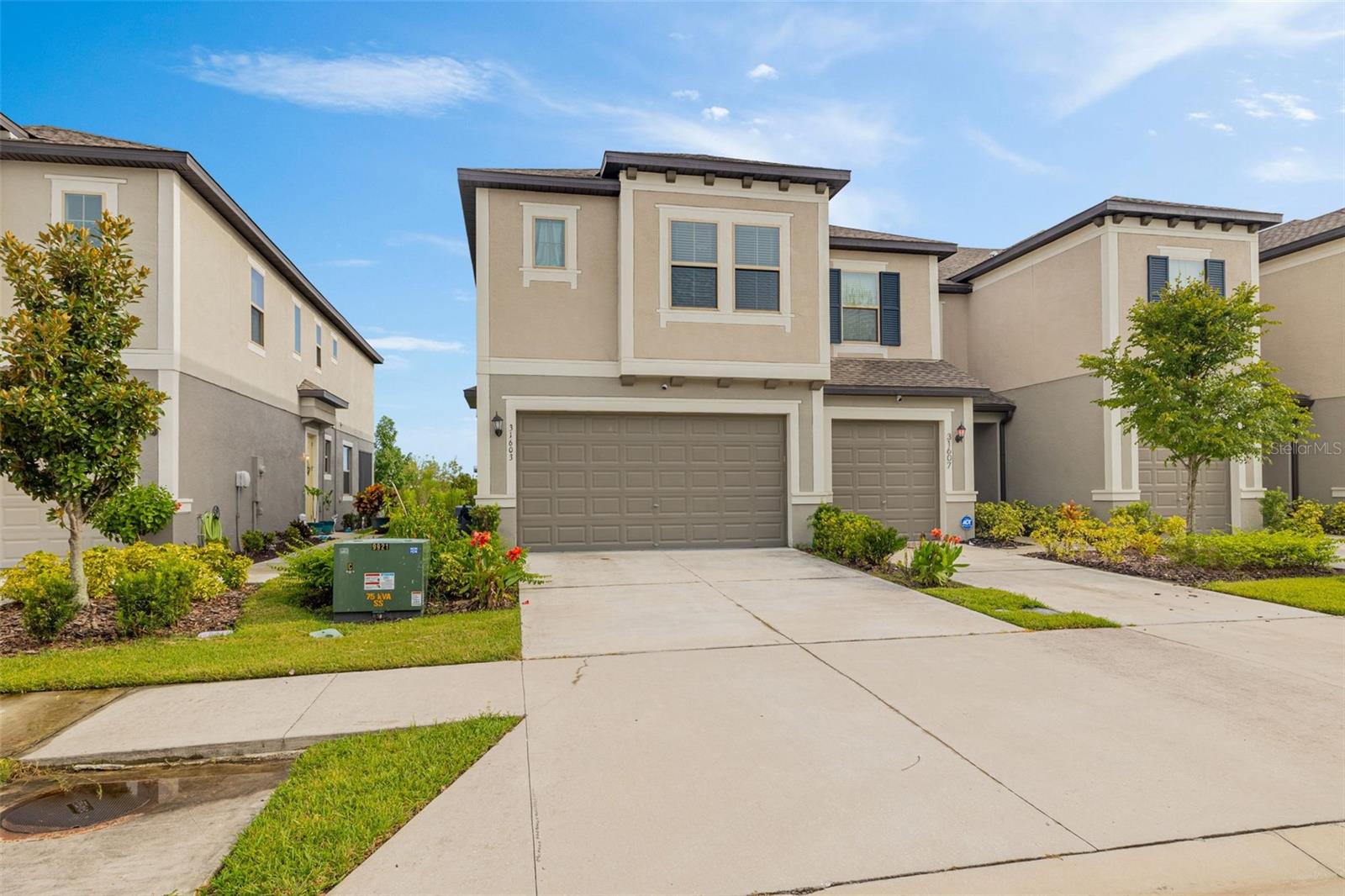 Your chance to live in the Crystal Lagoon Community is Here! Beautiful 3 bedroom, 2.5 bathroom, 2 car garage + loft. First floor features an open concept where the family can all gather for dinners and entertainment. Second floor you will find 3 bedrooms 2 full bathrooms and a loft. Master bedroom feature dual sinks, glass enclosed shower and a walk in closet. This unit is located on a corner lot for more privacy. Features a view of the Conservation, and you can watch the SUNSET from the Screened in patio and Family Room. The Crystal Lagoon is known for the tidal pools, cabanas, swim up bar restaurants, family beach , event pavilion and so much more. Come and enjoy living in one of the most sought out communities in the Wesley Chapel area.