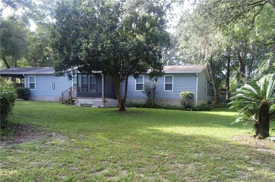 OWNER AGENT!!! FREE HOME WARRANTY. Very nice remolded mobile home just over a half-acre; with NO association bring your boat and RV. Very large covered porched just off the great room; Walnut laminate floors throughout with tile bathroom. A/C is new less than a year old, well pump and tank are new less than a year old, water heater less than a year old, all appliances less than a year old. There is also a screened-in front porch and a screened-in back porch.