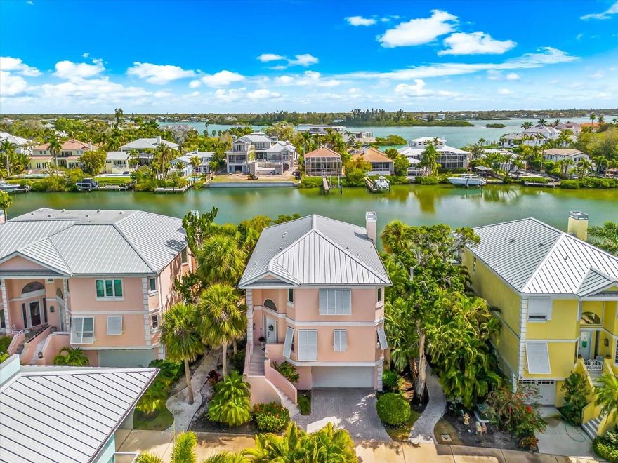 Located in the highly sought-after Hamilton Club community on Siesta Key, this beautifully updated 3-bedroom, 3.5-bath residence offers the ideal blend of coastal comfort, boating convenience, and island living. A large screened-in porch overlooking the water provides a peaceful setting to enjoy morning coffee and gentle coastal breezes.  Designed for both everyday living and entertaining, the home features a new private elevator, impact windows and doors, and your own private 10,000-lb boat lift with quick access to the water, making it easy to enjoy boating and the surrounding waterways.  Each well-appointed bedroom offers its own private en-suite bathroom, providing exceptional privacy for family and guests. The residence has been thoughtfully upgraded with kitchen updates completed in 2023, updated lighting throughout (2023), fully renovated bathrooms (2022–2023), and new wood flooring, creating a fresh, modern aesthetic with timeless coastal appeal.
Additional improvements include a new water softener and water pressure pump installed in 2025, enhancing everyday comfort and functionality. The home is offered furnished or unfurnished, allowing buyers the flexibility to move right in or personalize the space to their style.  Hamilton Club residents will also enjoy new community landscaping scheduled for this summer, with exterior building painting planned for 2027, both covered within HOA dues for added peace of mind. Ideally located just minutes from Siesta Key’s world-famous beaches, dining, and shopping, this residence offers an exceptional combination of water views, private boating access, modern upgrades, and relaxed island living.