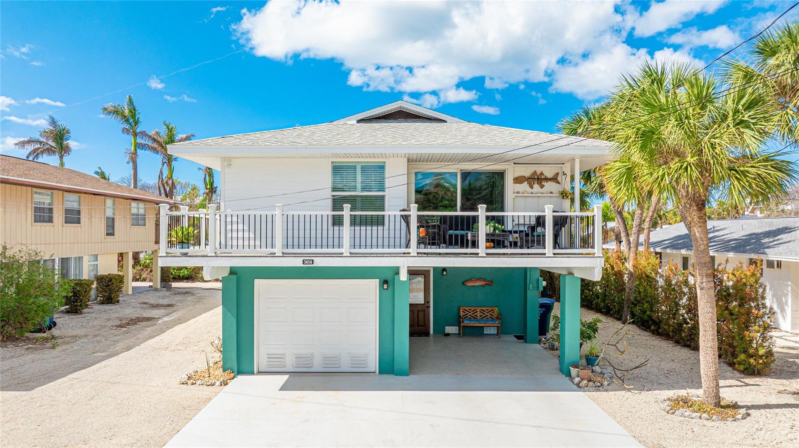 PRICE IMPROVEMENT.Elevated half duplex with only minor damage in the garage/storage area. The restoration has been completed.
The owners of this unit also owns Unit B and it's also for sale. The address is 5604 Carissa St Unit B. The parcel ID# is: 726660005 and the MLS # is: A4630195.
Approximately 100 steps to the pristine beach, close to all kinds of shopping, restaurants and more.
Weekly rental allowed however, the current owners have never rented this side.
Being sold As Is. Measurements are approximates and should be verified by the buyer.