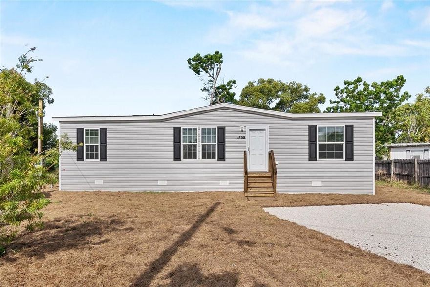 Pre-Construction. To be built. 1909 Pleasure Dr, Holiday, FL, Brand New Living, Effortless Style. Welcome to your pristine, move-in-ready sanctuary in the heart of Holiday, Florida! This beautifully constructed, brand-new manufactured home offers the perfect balance of modern luxury and functional design. Boasting an open-concept layout, this 3-bedroom, 2-bathroom residence is designed for comfort, entertaining, and ease of living.
Step inside to find sleek, durable vinyl flooring that flows seamlessly throughout the entire home. The heart of the house is the chef-inspired kitchen, featuring brand-new stainless-steel appliances, a spacious center island with a breakfast bar, crisp shaker-style cabinets, and a convenient pantry—a dream space for any home cook. The living area creates an inviting atmosphere for hosting guests or relaxing after a day at the nearby Gulf Coast beaches. Retreat to the serene master suite, your private getaway complete with a large walk-in closet and a luxurious en-suite bathroom featuring a double-sink vanity and a walk-in shower. Two additional spacious bedrooms offer versatility for family, a home office, or guest quarters, with a secondary full bathroom conveniently nearby. Completing this home is a dedicated utility room, providing ample laundry space and extra storage. Whether you are looking for your first home or a turnkey Florida retreat, 1909 Pleasure Dr is an opportunity you don’t want to miss. Come see the quality and attention to detail for yourself!
