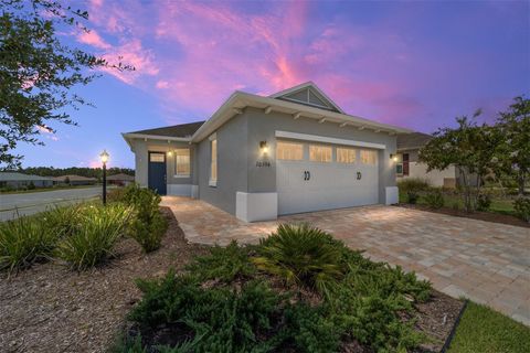 Photo of 10394 SW 96th Loop, Ocala, FL 34481 (MLS # OM707207)