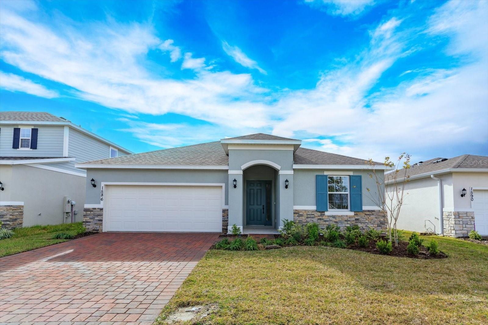 Under Construction. Welcome to this stunning Dream Finders MULBERRY floorplan, located in the highly sought-after community of Willowbrook near a beautiful golf course in Winter Haven, FL. This spacious 4-bedroom, 2 and a half-bath home offers 1,938 square feet of living space, and providing excellent curb appeal in it's elevation.
Inside, you'll find gorgeous gray cabinets complemented by sleek quartz countertops in the kitchen, creating a modern, bright atmosphere. Wood style tiles flooring runs throughout the wet and common areas, offering durability and easy maintenance. The open layout is perfect for family gatherings and entertaining guests.