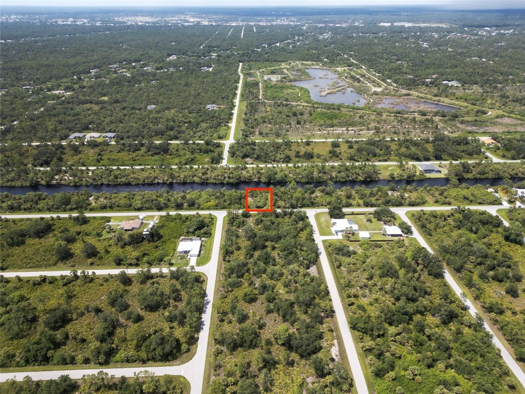 Photo of 14280 Mcclellan Avenue, Port Charlotte, FL 33953 (MLS # O6444152)