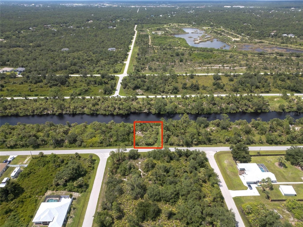 Photo of 14280 Mcclellan Avenue, Port Charlotte, FL 33953 (MLS # O6444152)