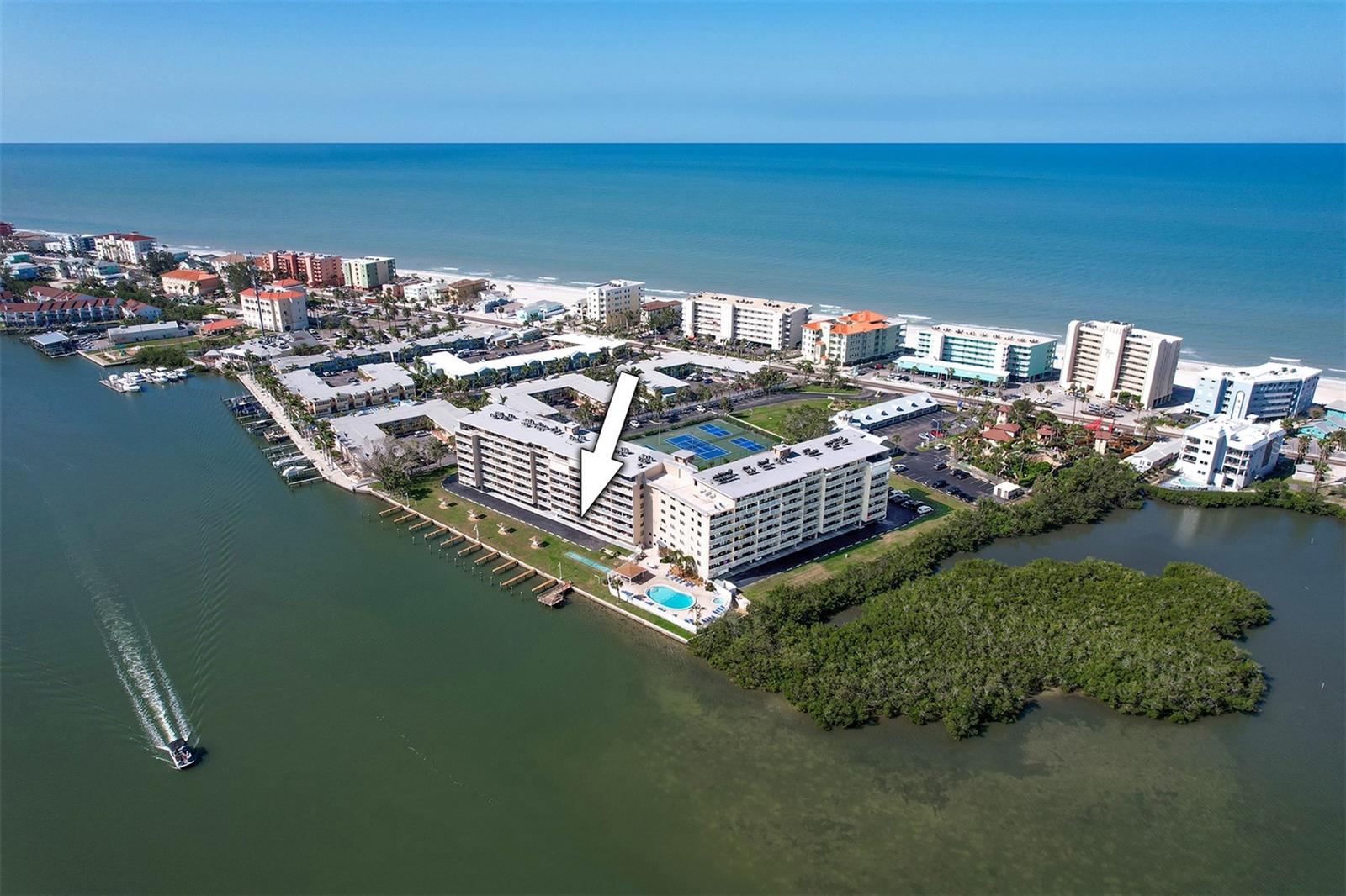 Weekly rentals permitted! Amazing opportunity! This two-bedroom, two-bath intracoastal front condominium at Bay Shores Yacht & Tennis Club of Indian Shores hits the market. This prime location in the building offers breathtaking water views of the Intracoastal Waterway while just being a short distance from Gulf of Mexico beaches. The spacious balcony extends 24 feet long by 5.11 feet wide where you can enjoy the fresh air while watching the epic sunrises, dolphins, wildlife and cruising boats. In addition, you can enjoy world-famous Florida sunsets from the front breezeway. To complement all these outstanding views, this unit has a spacious floor plan and is meticulously kept and fully furnished, ready to stay or rent to a vacationer. The ability to rent short-term, combined with resort-style amenities, results in strong income potential! One assigned parking space and plenty of guest parking. This unit is amazing! This community is also unique with an impressive list of amenities. BSYT is on 4.5 acres of Intracoastal Waterway frontage and directly across the street from the beach. Owners and guests can enjoy the fishing pier, approximately 20 first-come, first-serve boat slips, picnic gazebos, shuffleboard court, heated pool and hot tub, an eighth-floor observation deck with views for miles, clubhouse, men and women's sauna, four tennis courts (one doubles as a pickleball court), a putting green, designated areas for bikes and kayak/paddle board storage, next door to Smuggler's Cove Putt golf attraction, many boutique shops/restaurants, and most importantly right across the street from the beach. There is a pedestrian crosswalk and beach access directly across from the location of this condominium. It's a one-minute walk to the white sugar sand beaches of Indian Shores. Within 40 minutes of two international airports. No pets. See what this unit and Bay Shores Yacht & Tennis has to offer, you won’t be disappointed!