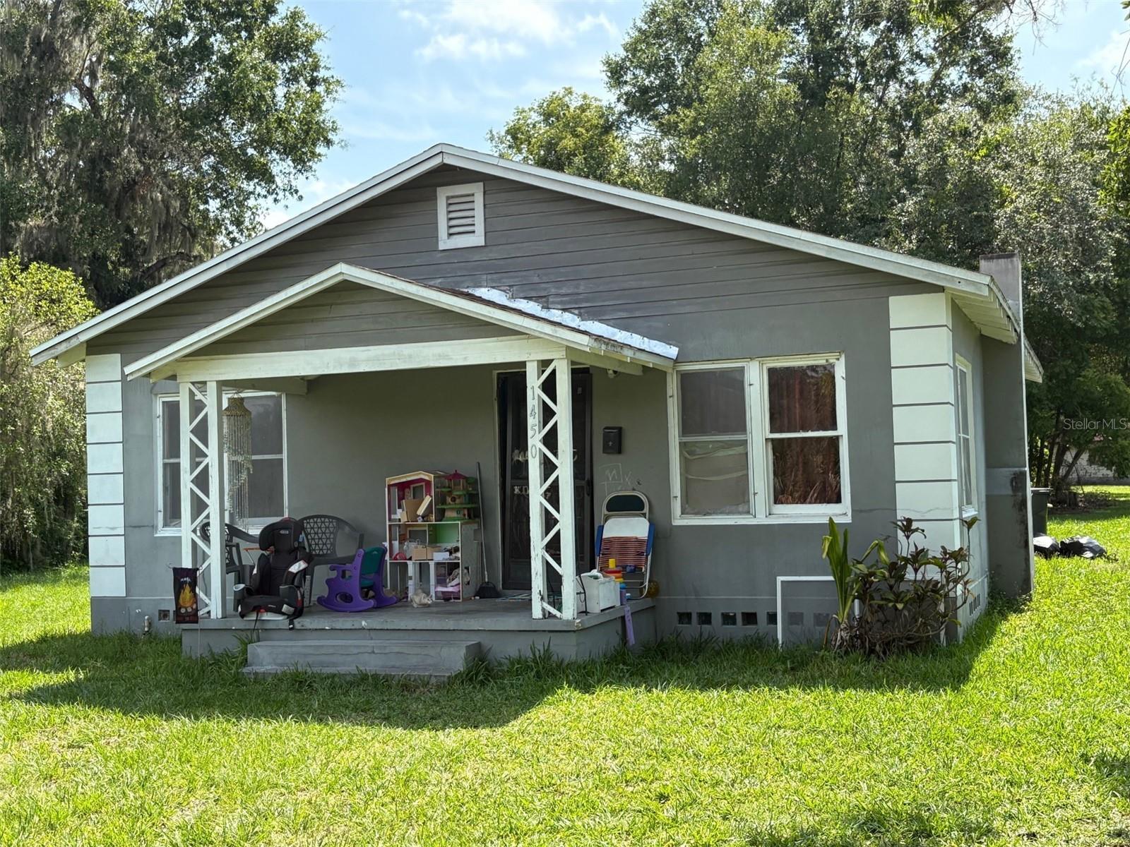 Don’t miss this 2-bedroom, 1-bath home located on over half an acre at 1450 Emerson Ave, Bartow. Plenty of space from neighbors with a view of Lake Ruth! With a little TLC, this property has incredible potential—whether you're looking to build your next set of duplexes, fix and flip, rent out, or create your dream starter home. Plenty of outdoor space, endless possibilities!
