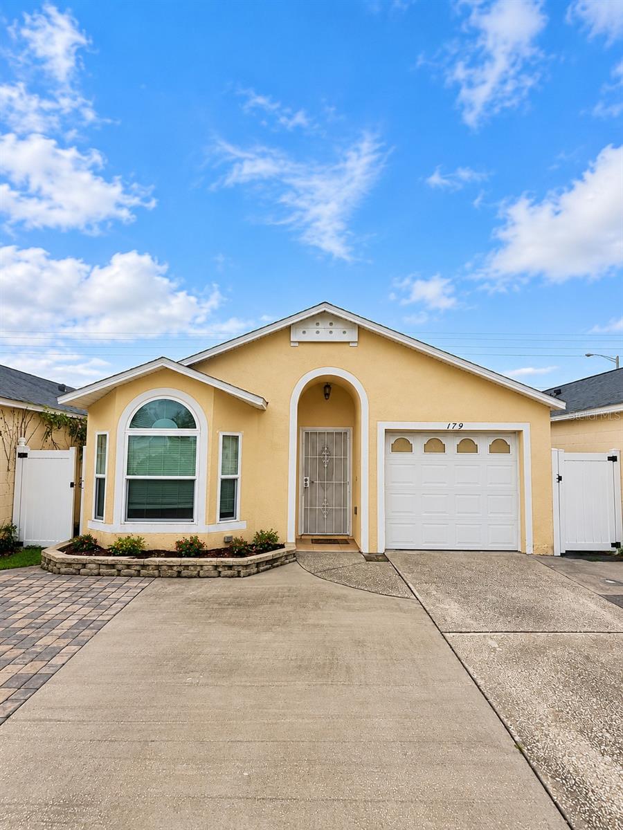 Photo of 179 Dahlia Village Circle #63, Orlando, FL 32807 (MLS # O6446781)